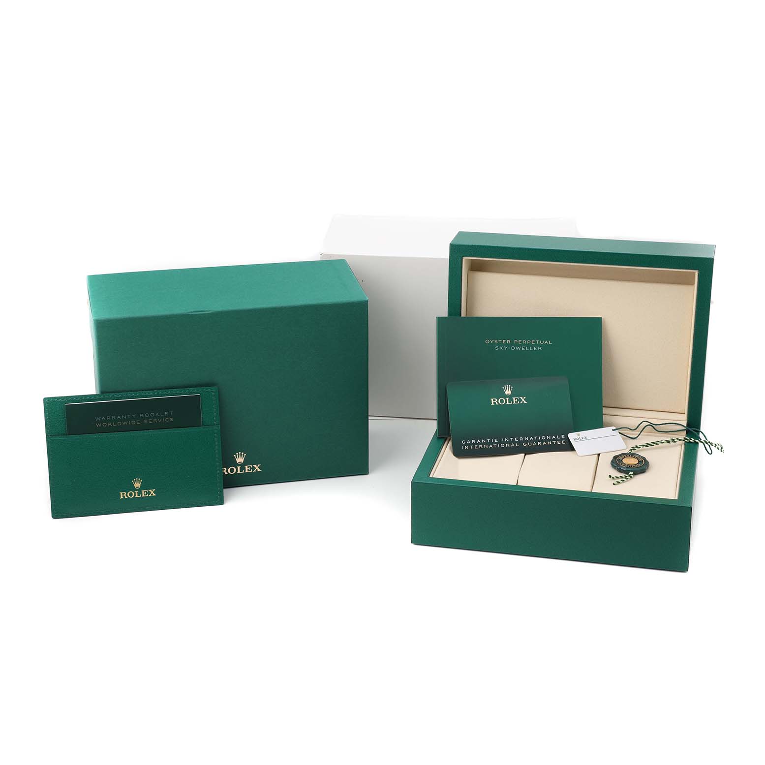 The image shows Rolex Sky-Dweller 336934 Men's Stainless Steel Blue Dial packaging and accessories, including boxes, booklets, and a hang tag viewed from the front.