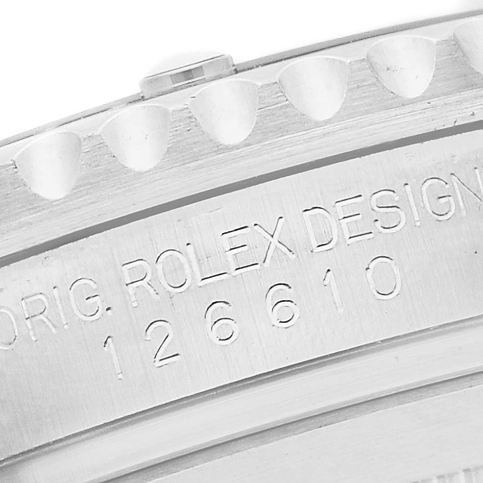 The image shows a close-up of the engraved case edge of a Rolex Submariner 126610 Men
s Stainless Steel Black Dial 126610 Men
s Stainless Steel Black Dial watch, focusing on the model number 126610.
