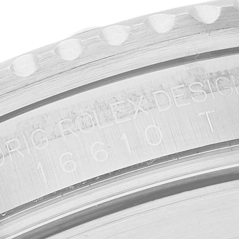 This image shows a close-up of the side bezel and engraved serial number on a Rolex Submariner 16610 Men
s Stainless Steel Black Dial 16610 Men
s Stainless Steel Black Dial watch.
