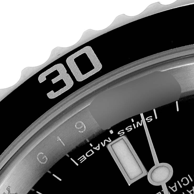 The image shows a close-up of the bezel and dial of a Rolex Submariner 14060M Men
s Stainless Steel Black Dial 14060M Men
s Stainless Steel Black Dial watch, focusing on the "30" marker.