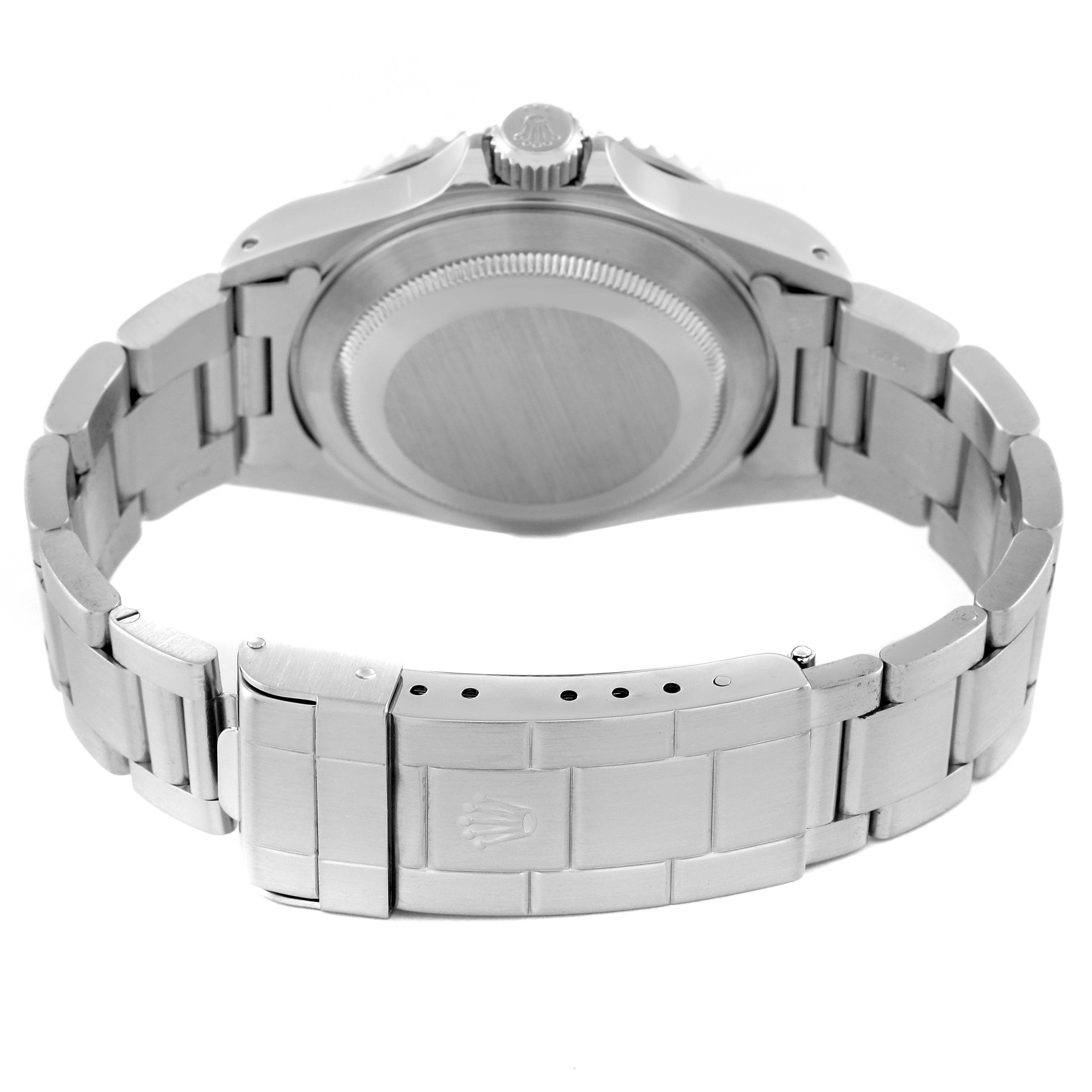 This image shows the rear view of a Rolex Submariner 14060M Men
s Stainless Steel Black Dial 14060M Men
s Stainless Steel Black Dial watch, focusing on the case back and clasp of the bracelet.