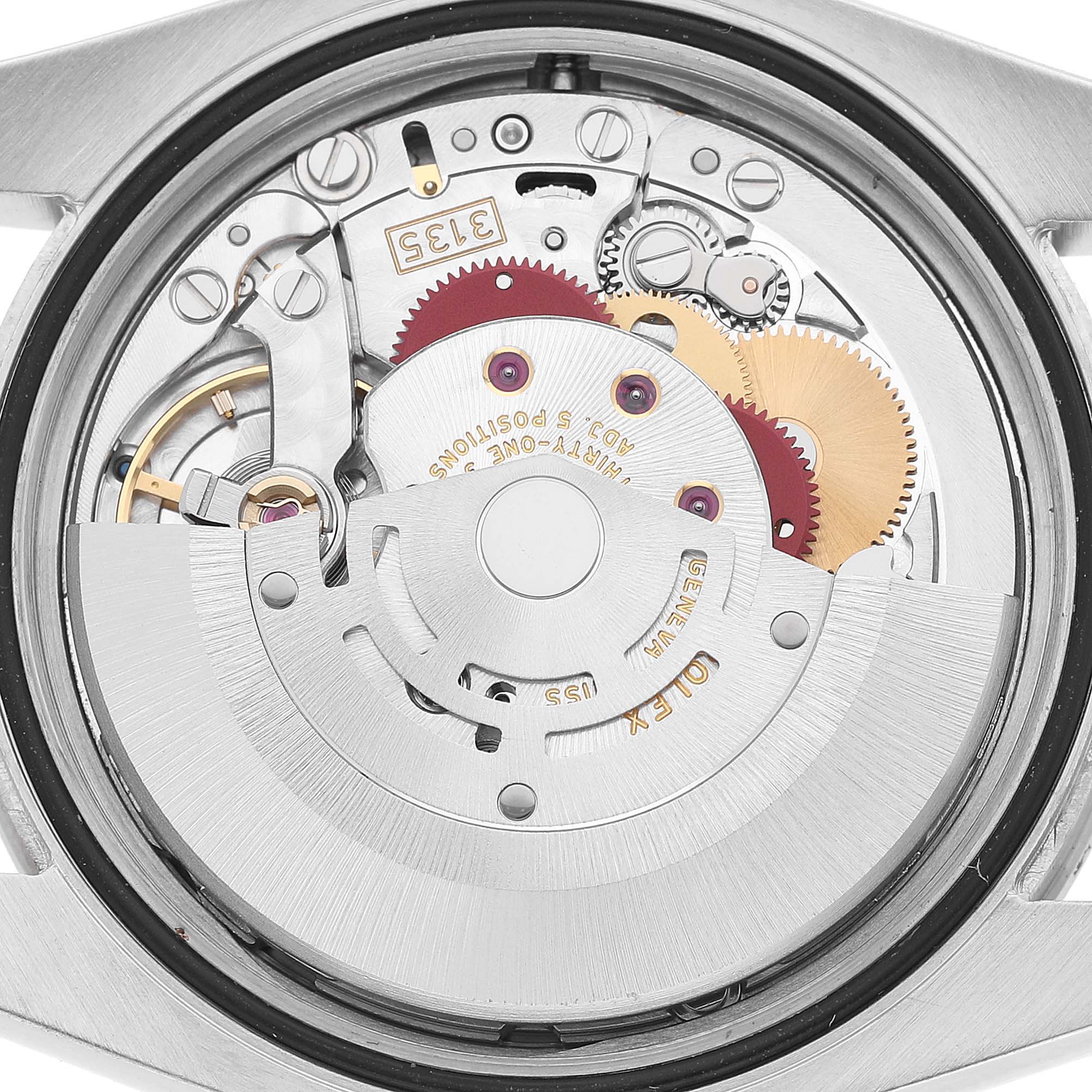 The image shows the internal movement of a Rolex Turn-o-Graph 116264 Men's Stainless Steel Black Dial watch, highlighting gears and intricate mechanics.