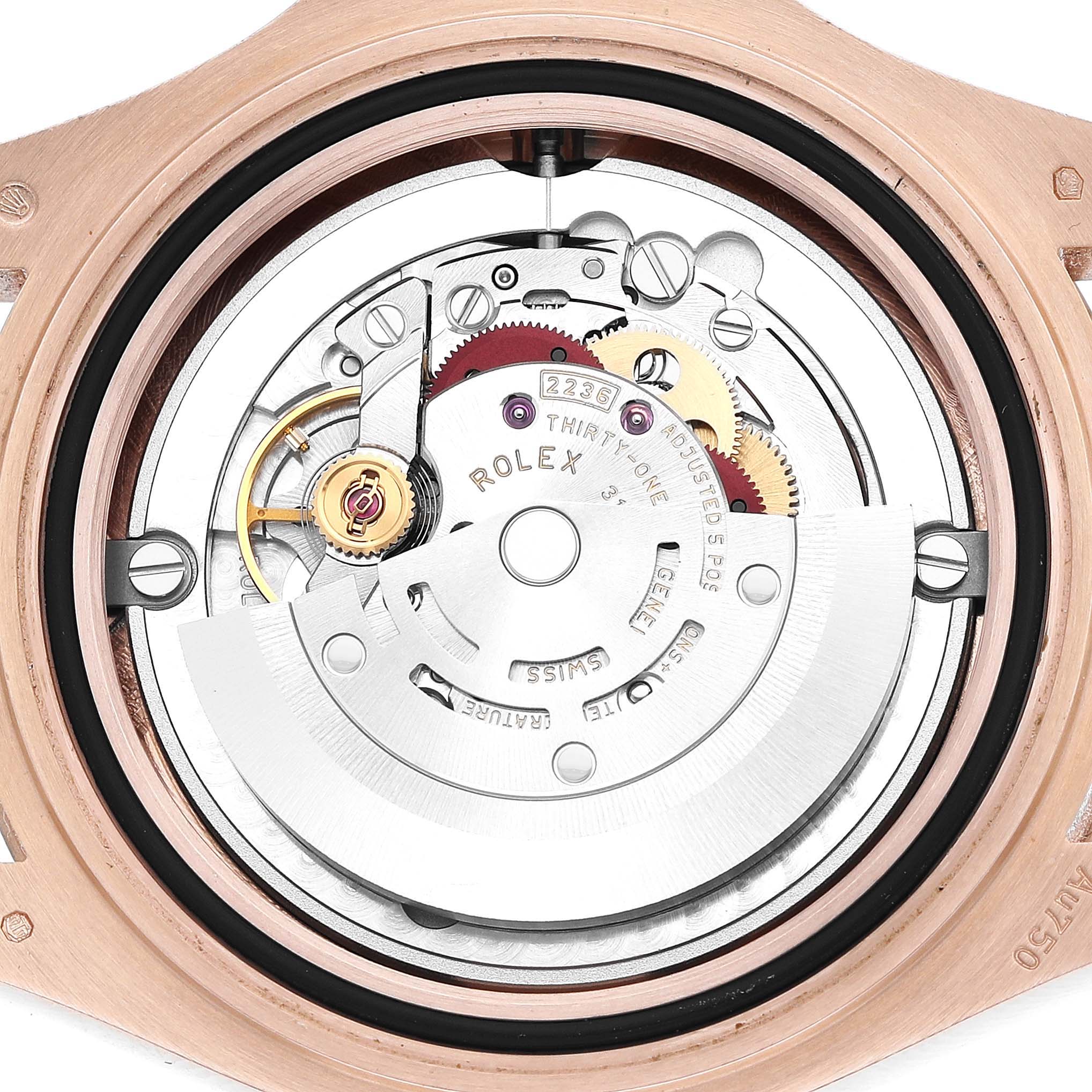 The image shows the internal movement of a Rolex Yacht-Master 268655 Men's Rose Gold Black Dial watch from a top-down angle, highlighting the gears and rotor.