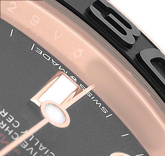 The image shows a close-up of the bezel, hour marker, and part of the dial on a Rolex Yacht-Master 268655 Men's Rose Gold Black Dial watch.