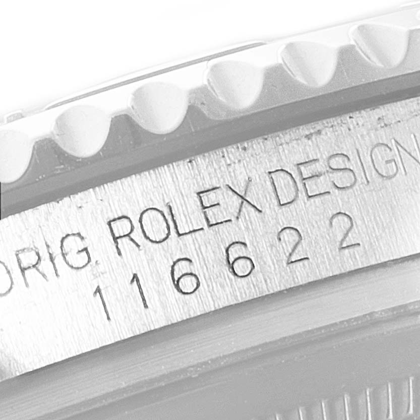 The image shows a close-up of the side of a Rolex Yacht-Master 116622 Men's Stainless Steel Blue Dial 116622 Men's Stainless Steel Blue Dial watch, showcasing the model number and "Rolex Design" engraving.