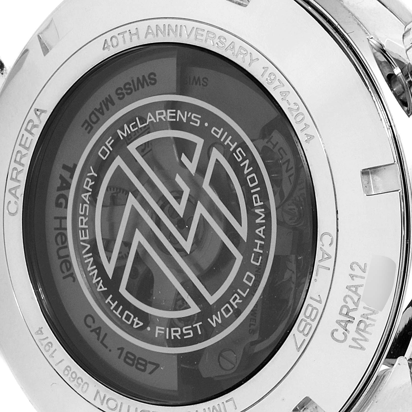The image shows the back case of a Tag Heuer Carrera CAR2A12.FT6033 Men's Stainless Steel White Dial CAR2A12.FT6033 Men's Stainless Steel White Dial watch, highlighting the anniversary engraving and internal mechanics.