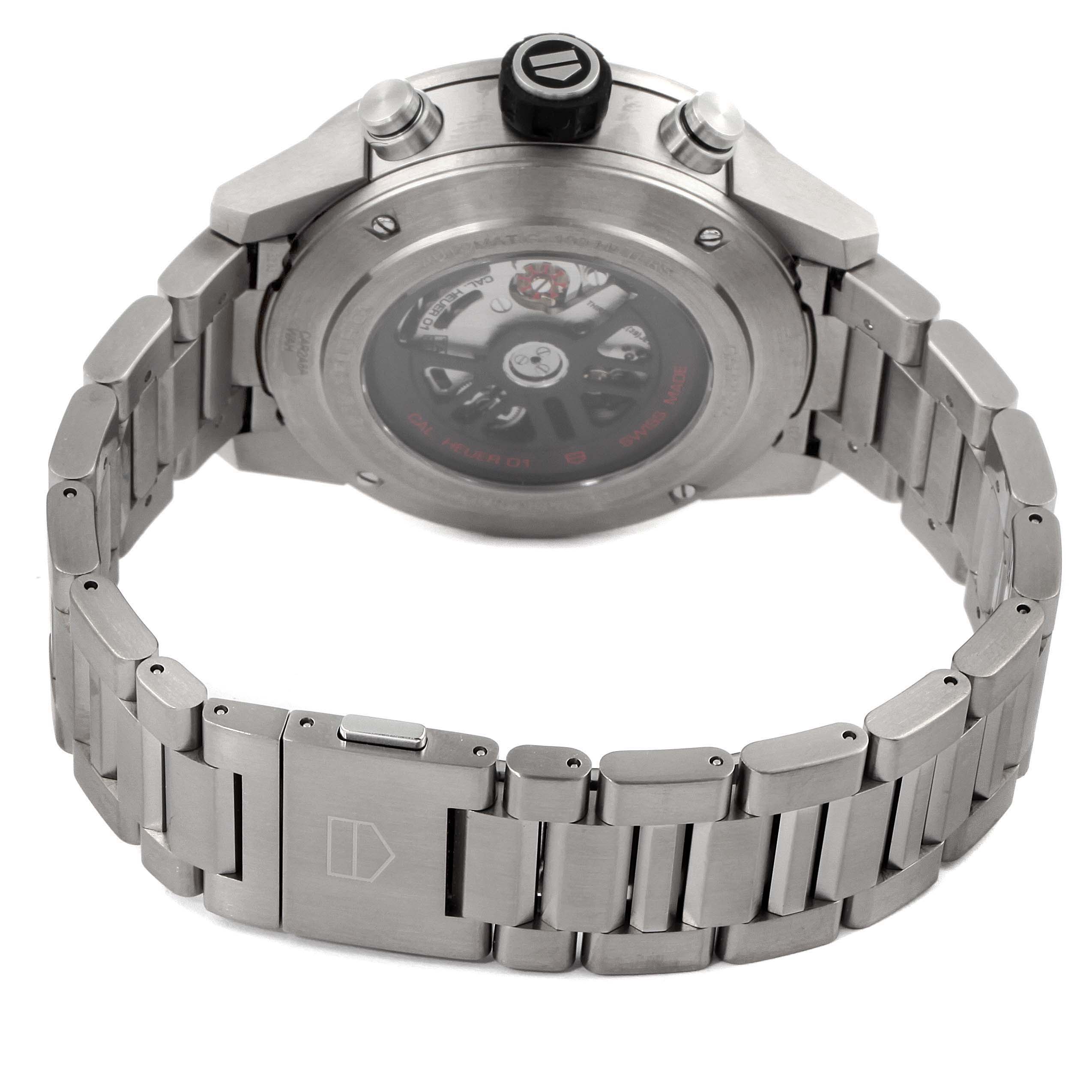 The Tag Heuer Carrera CAR2A8A.FT6072 Men's Titanium Grey Dial CAR2A8A.FT6072 Men's Titanium Grey Dial watch is shown from the back, highlighting its caseback, crown, and stainless steel bracelet.