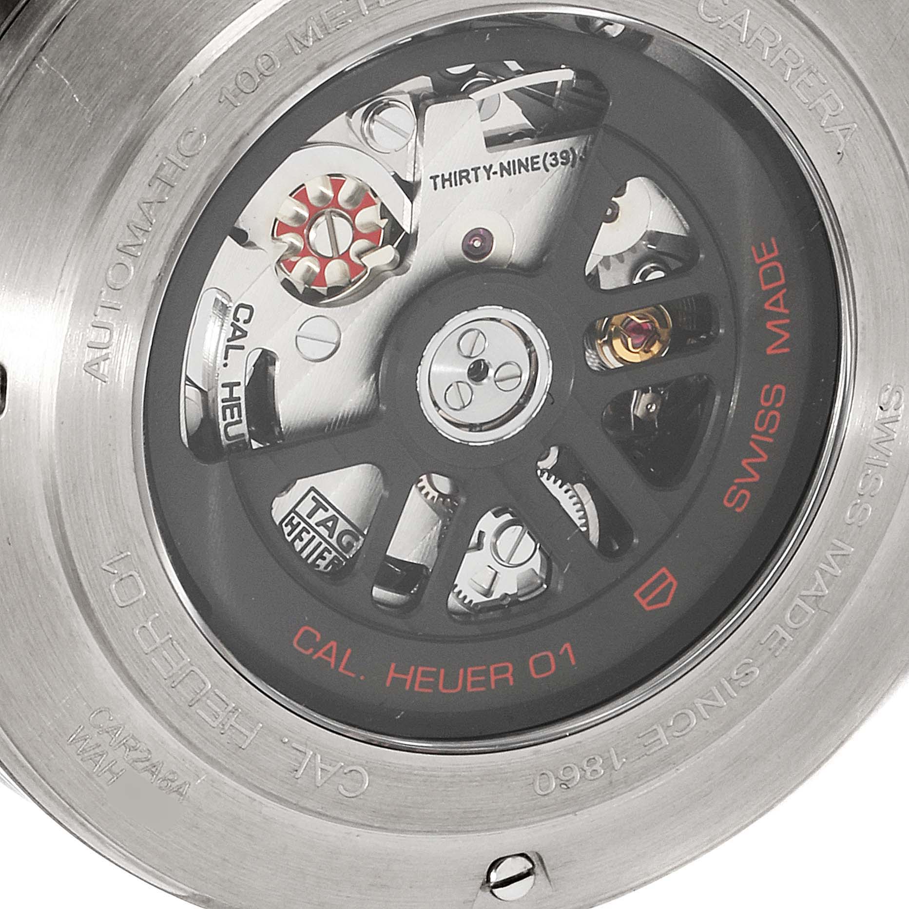 The image shows the back view of the Carrera model by Tag Heuer, highlighting its automatic movement mechanism.