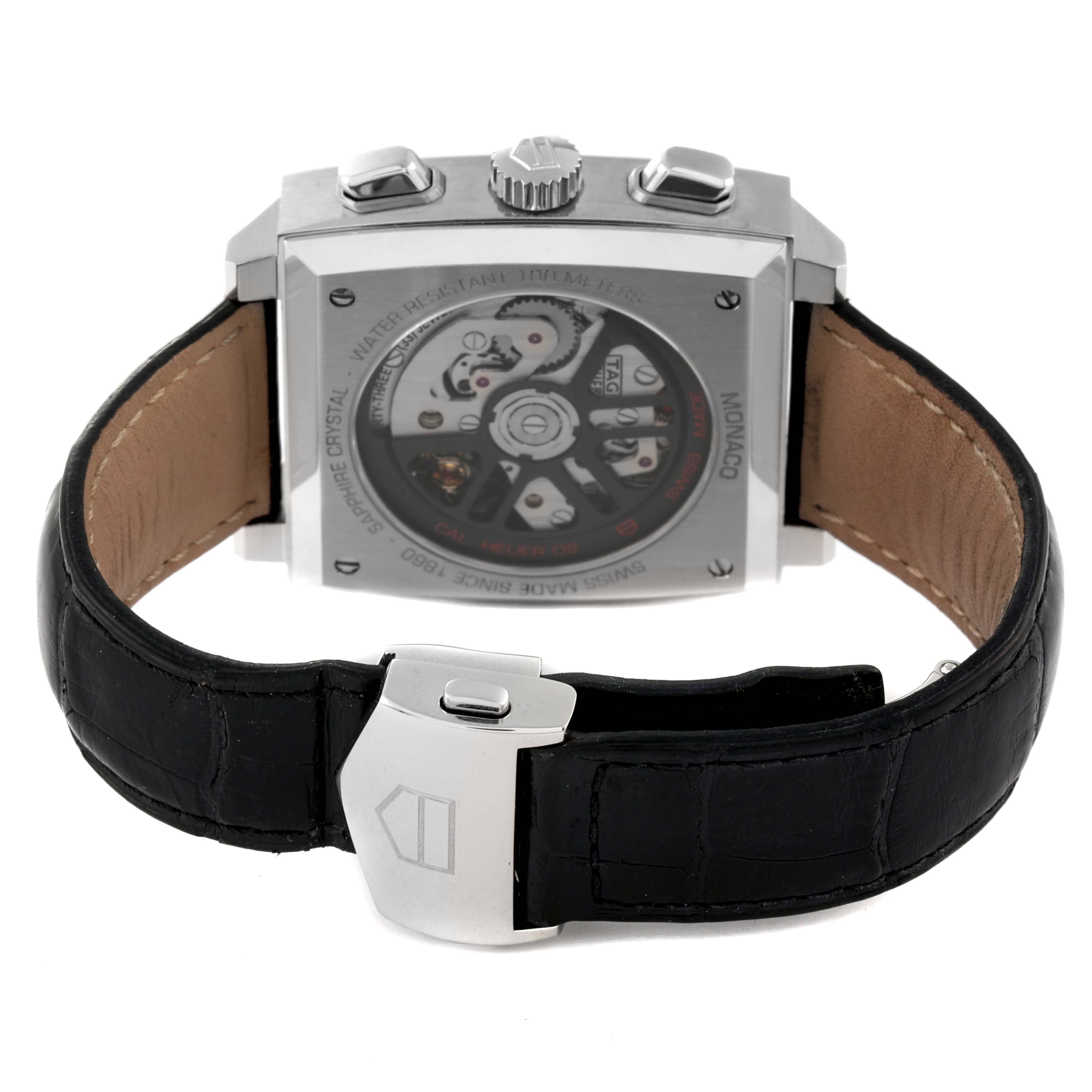 The image shows the back view of the Tag Heuer Monaco CBL2113 Men
s Stainless Steel Black Dial CBL2113 Men
s Stainless Steel Black Dial watch, highlighting its automatic movement and black leather strap.