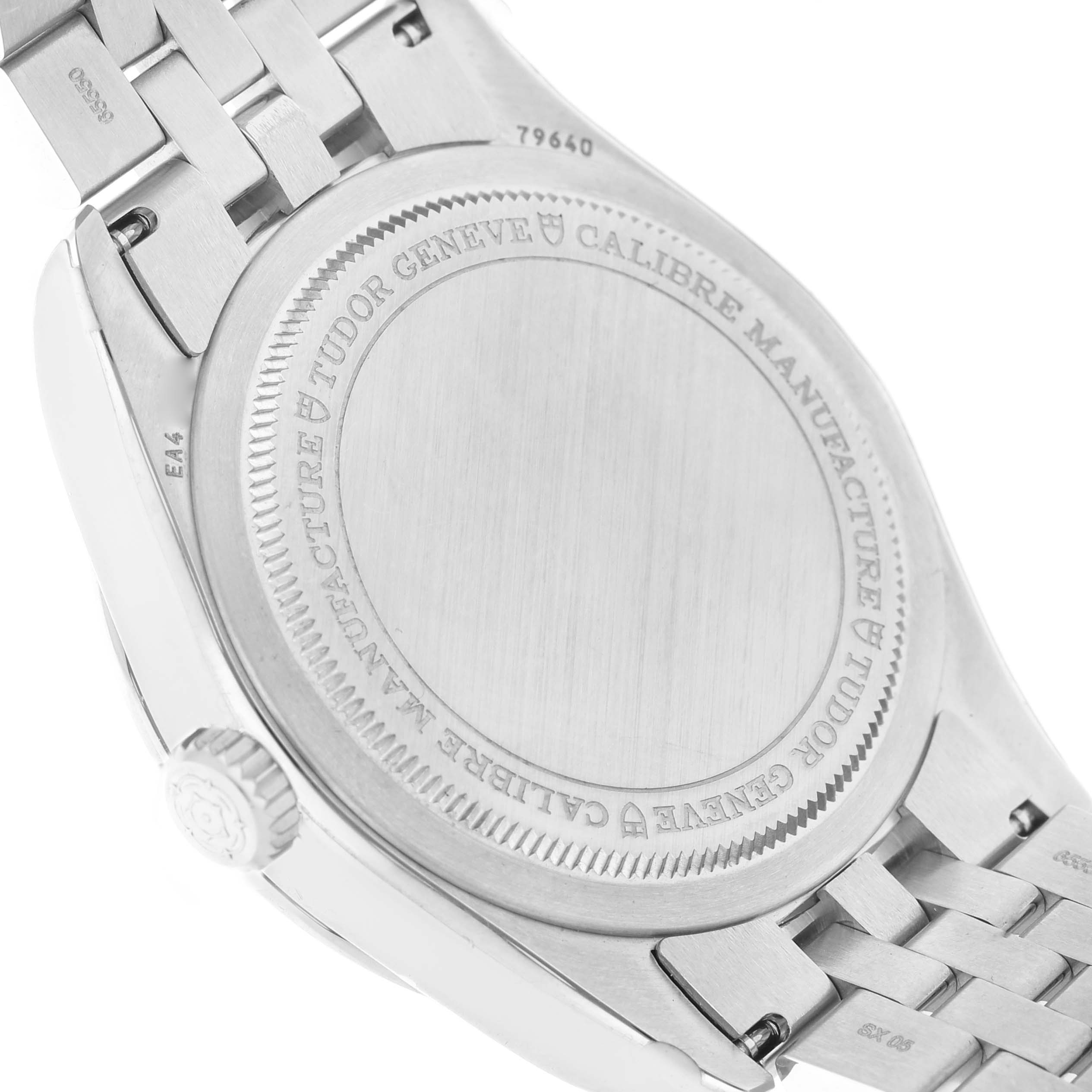 The image shows the case back and bracelet of a Tudor Heritage Black Bay 79640 Men's Stainless Steel Silver Dial watch, with engraving details visible.