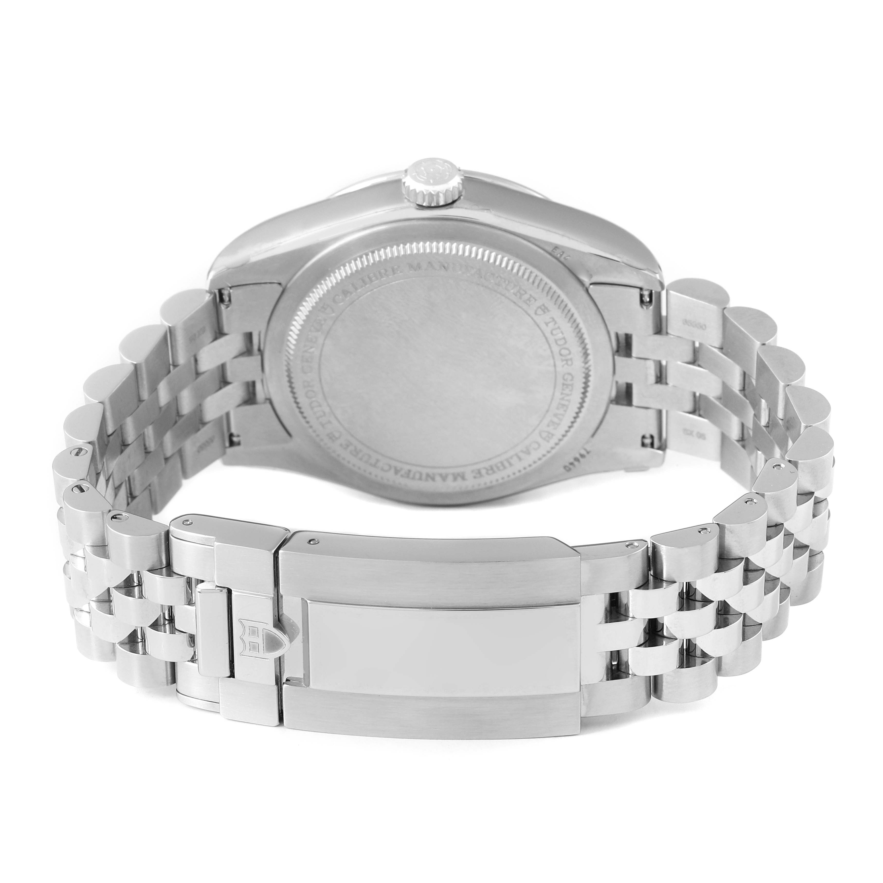 The image shows the back of the Tudor Heritage Black Bay 79640 Men's Stainless Steel Silver Dial watch, highlighting its case back, crown, and bracelet clasp.