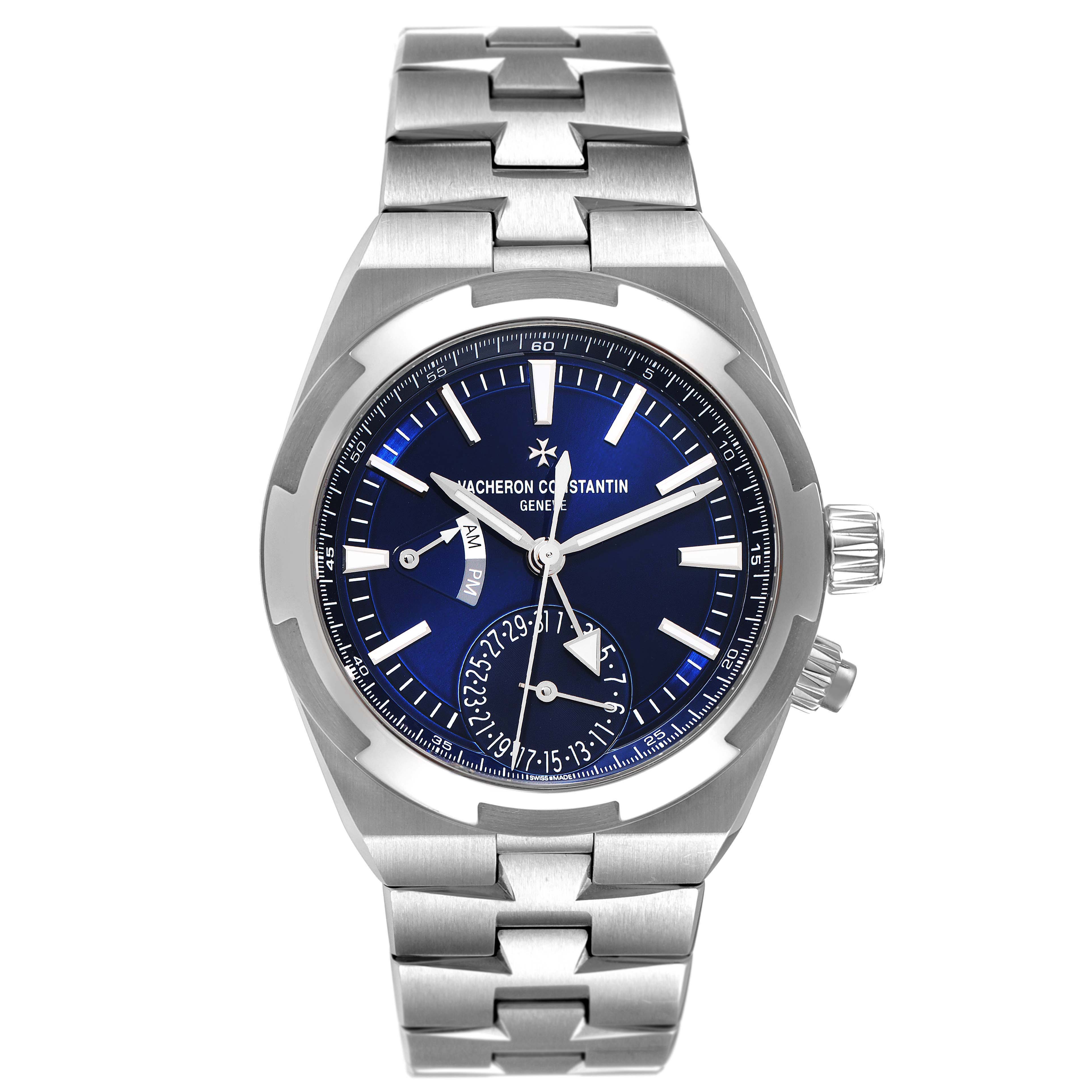The image shows a front angle of a Vacheron Constantin Overseas 7900V/110A-B334 Men's Stainless Steel Blue Dial 7900V/110A-B334 Men's Stainless Steel Blue Dial model watch, highlighting its face, hands, and metal bracelet.
