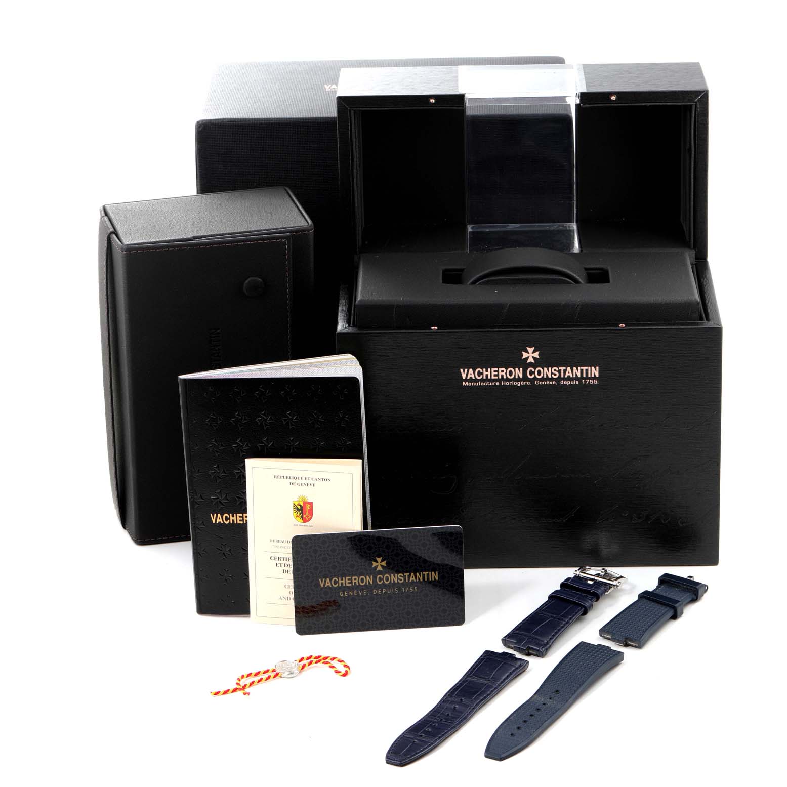 The image shows the packaging, documentation, and extra straps for the Vacheron Constantin Overseas 7900V/110A-B334 Men's Stainless Steel Blue Dial 7900V/110A-B334 Men's Stainless Steel Blue Dial watch model.