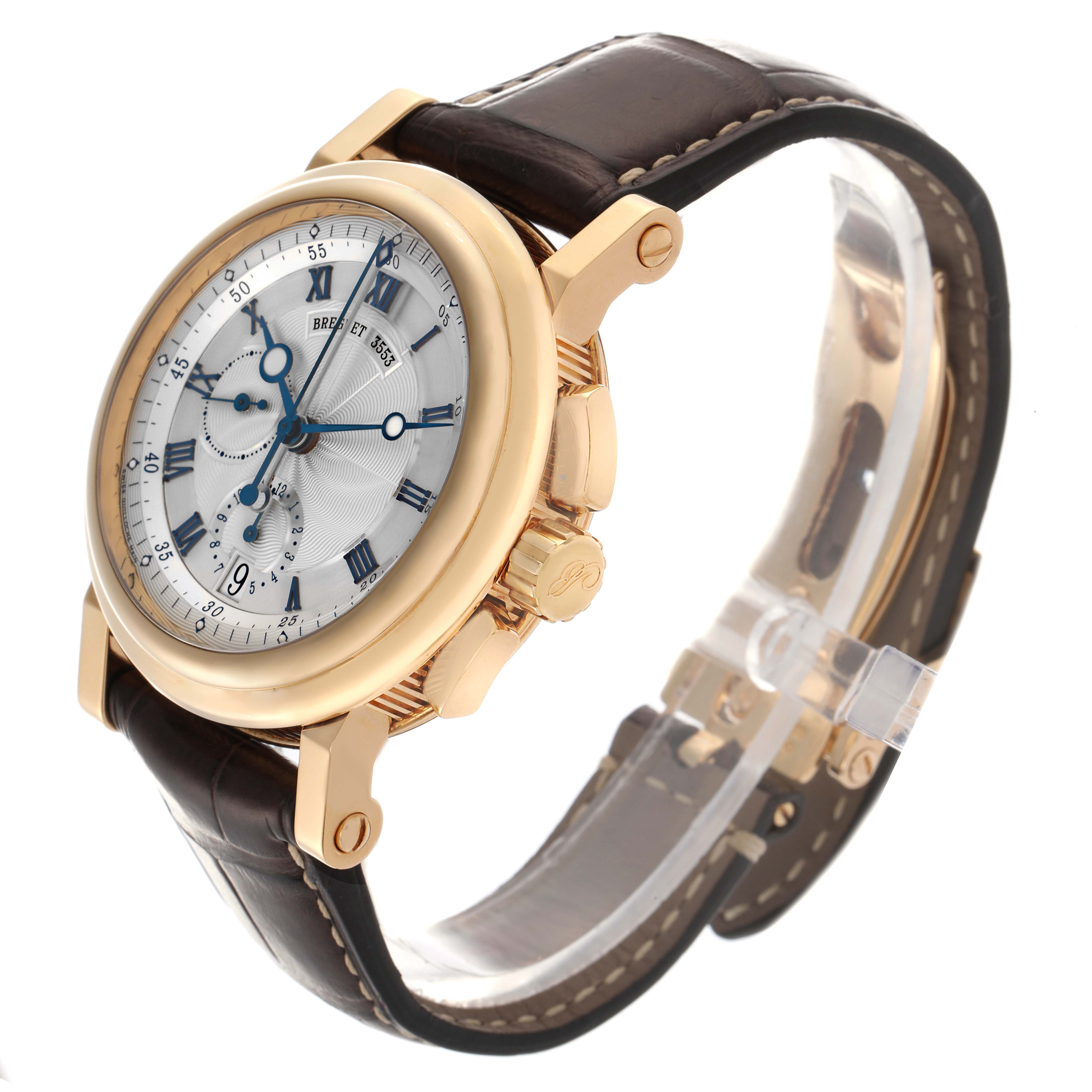 The Breguet Marine 5827BA/12/9Z8 Men's Yellow Gold Silver Dial 5827BA/12/9Z8 Men's Yellow Gold Silver Dial watch is shown at an angle highlighting the face, crown, pushers, and leather strap.
