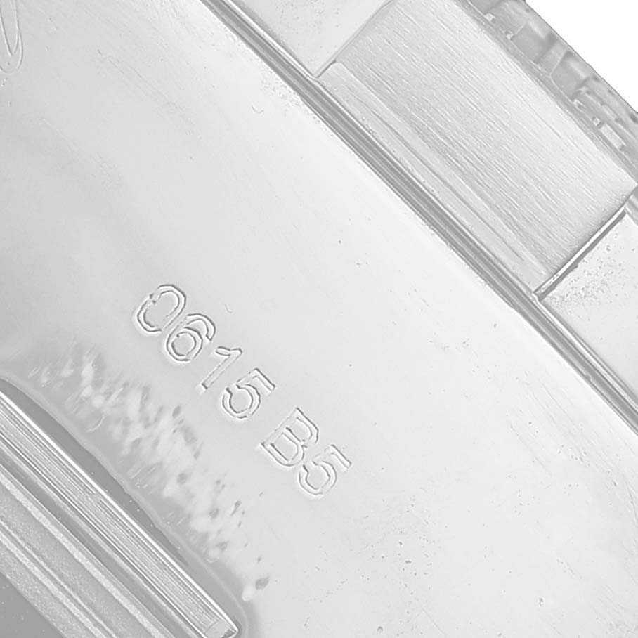 The image shows a close-up of the engraved back of a Breitling Avenger A13371 Men's Stainless Steel White Dial watch.