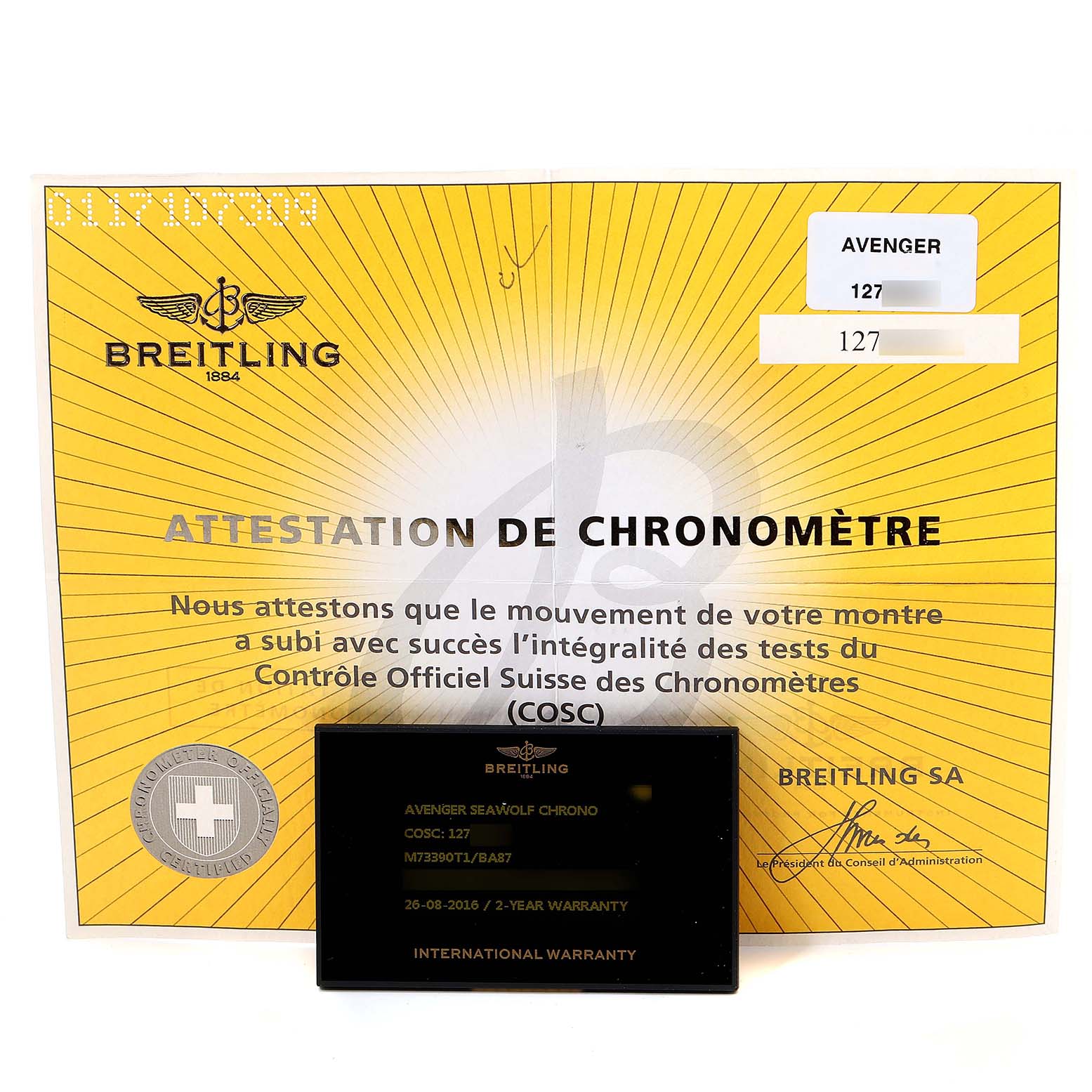 The image shows a chronometer certificate and warranty card for the Breitling Avenger M73390 Men's Stainless Steel Black Dial M73390 Men's Stainless Steel Black Dial model.