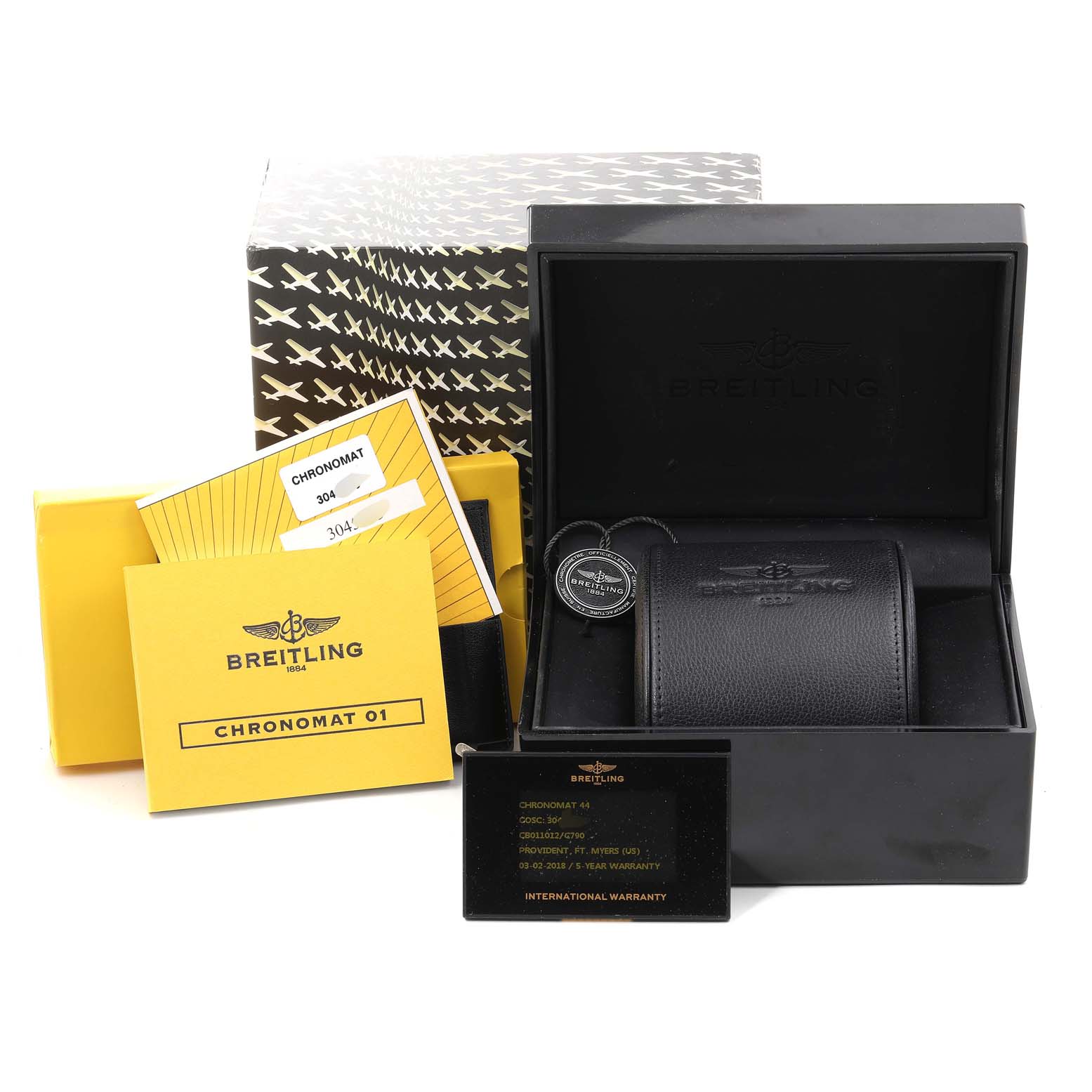 The image shows various accessories for a Breitling Chronomat CB011012/C790 Men's Steel and Gold (two tone) Blue Dial CB011012/C790 Men's Steel and Gold (two tone) Blue Dial watch, including the box, warranty cards, and manual, from a frontal angle.