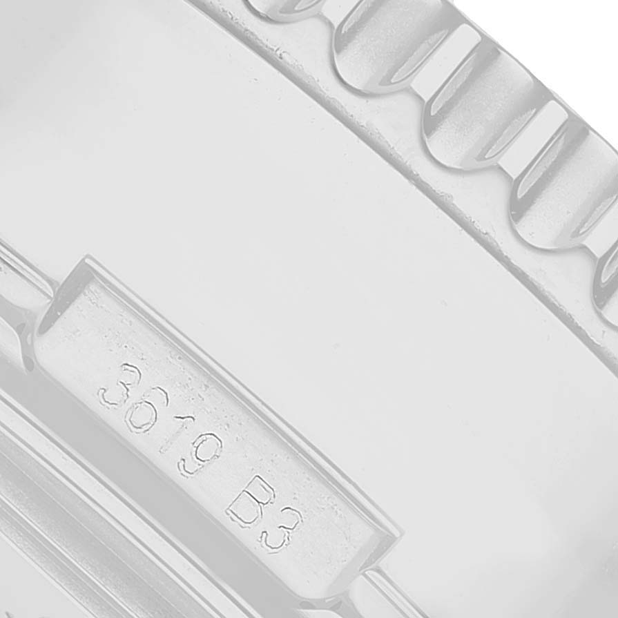 The image shows a close-up of the edge of a Breitling Navitimer AB0311 Men's Stainless Steel Silver Dial watch, focusing on the bezel and part of the case.