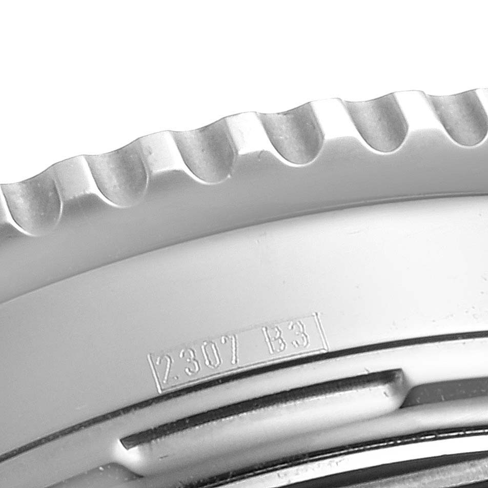 This image shows a close-up of the bezel edge and part of the case of the Breitling Navitimer A23322 Men's Stainless Steel Silver Dial A23322 Men's Stainless Steel Silver Dial watch.