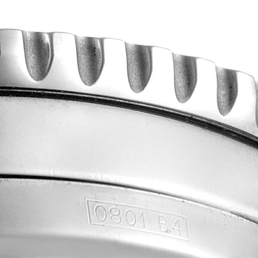 The image shows a close-up of the bezel and engraved part of a Breitling Navitimer A22322 Men's Stainless Steel Silver Dial A22322 Men's Stainless Steel Silver Dial watch.