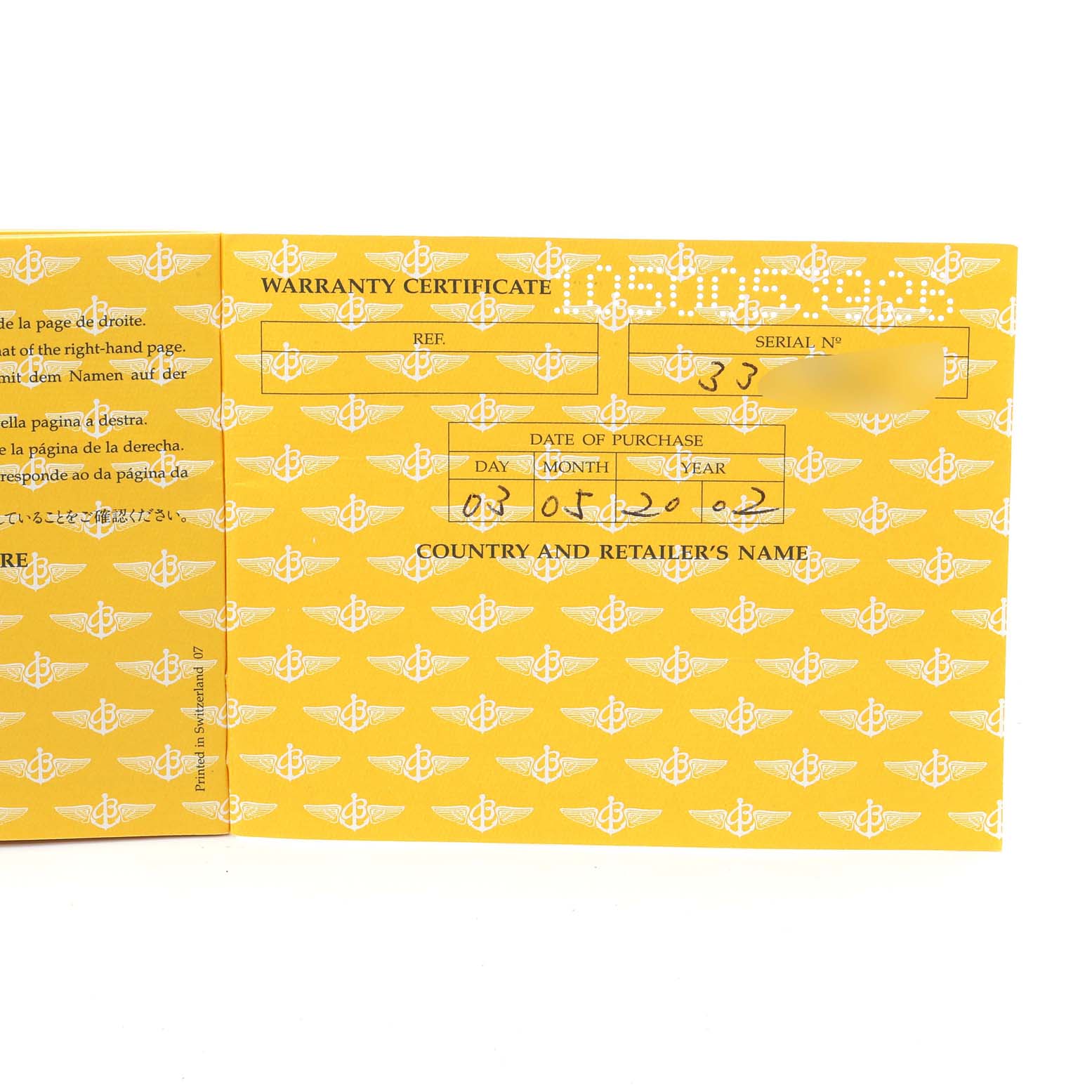 The image shows the warranty certificate for a Breitling Navitimer A13330 Men's Stainless Steel Black Dial A13330 Men's Stainless Steel Black Dial watch, viewed from a top-down angle.