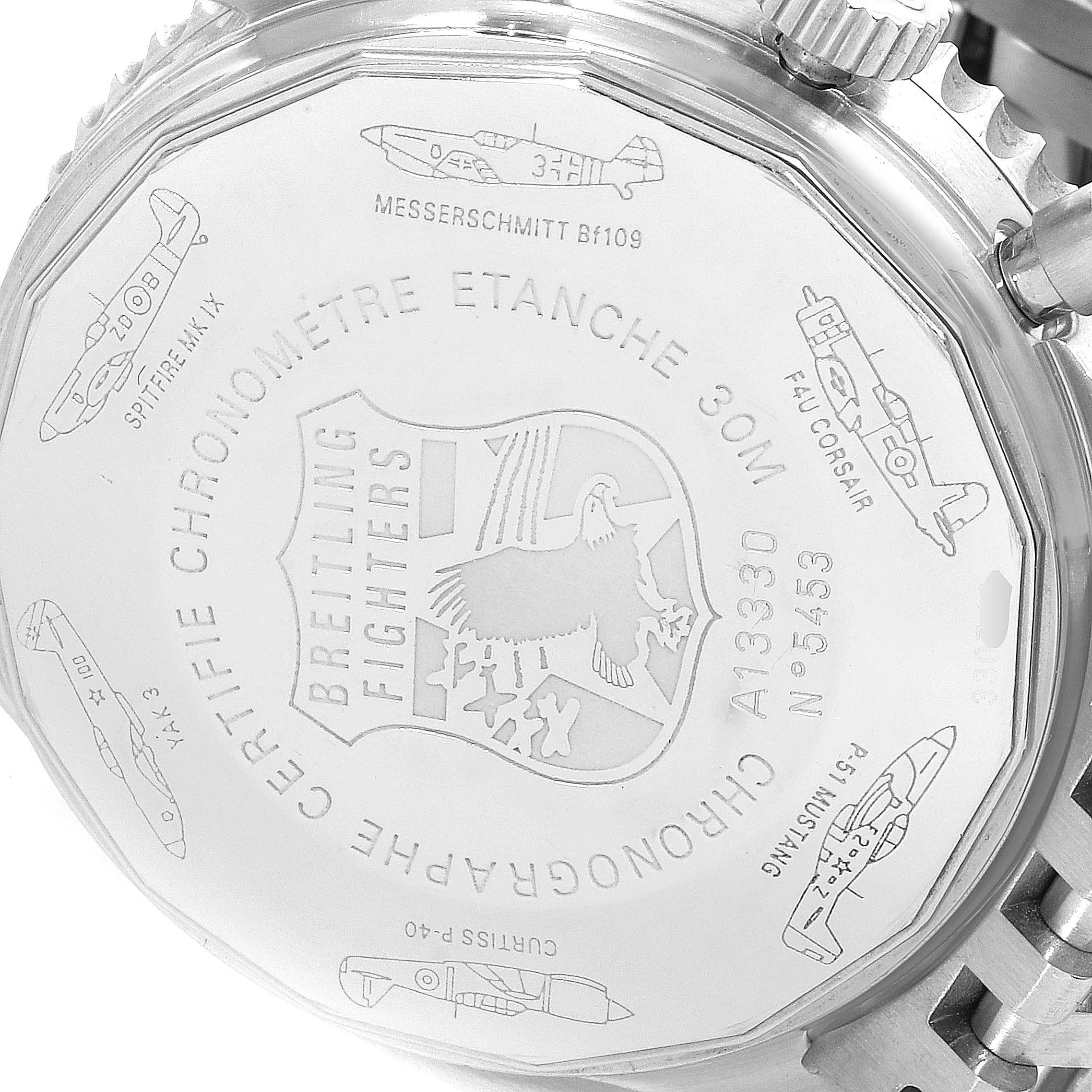 The image shows the case back of a Breitling Navitimer A13330 Men's Stainless Steel Black Dial A13330 Men's Stainless Steel Black Dial watch, displaying engraved airplane models and Breitling Fighters insignia.