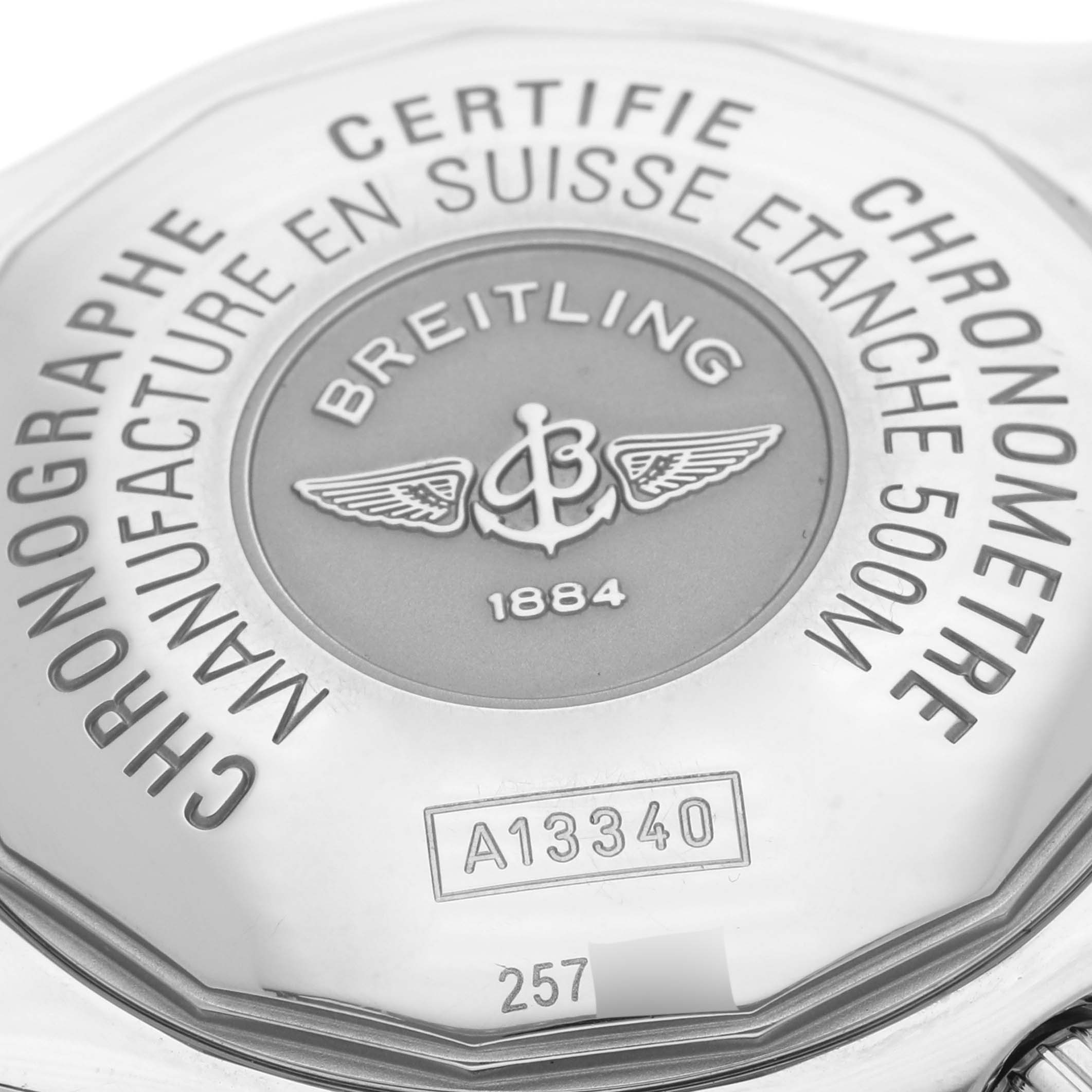 The image shows the back of a Breitling Superocean A13340 Men's Stainless Steel Black Dial A13340 Men's Stainless Steel Black Dial watch, highlighting its engraved details and logo.