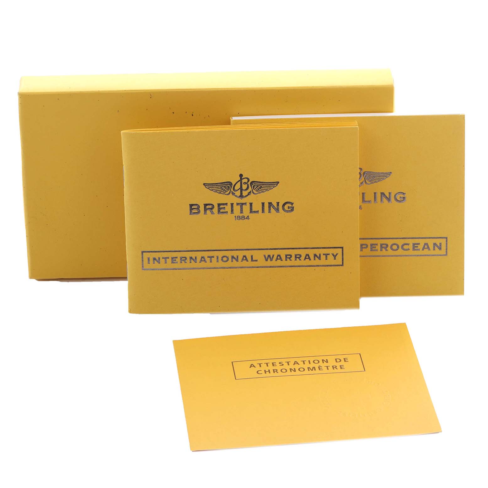 The image shows Breitling Superocean A13340 Men's Stainless Steel Black Dial A13340 Men's Stainless Steel Black Dial watch accessories, including an international warranty, manuals, and a chronometer attestation.