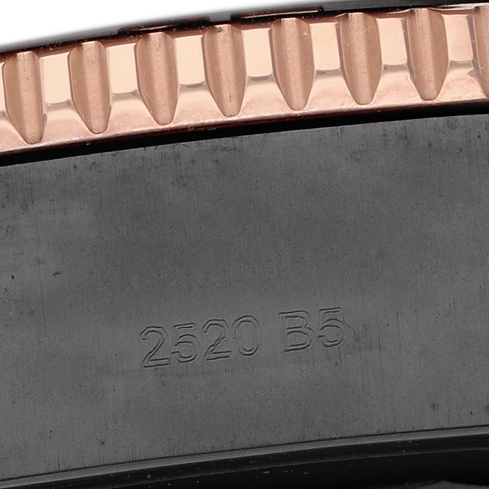 The image shows a close-up of the bezel and part of the case back of the Breitling Superocean U17368 Men's Steel and Gold (two tone) Black Dial U17368 Men's Steel and Gold (two tone) Black Dial watch, featuring textured edging and an engraved number.