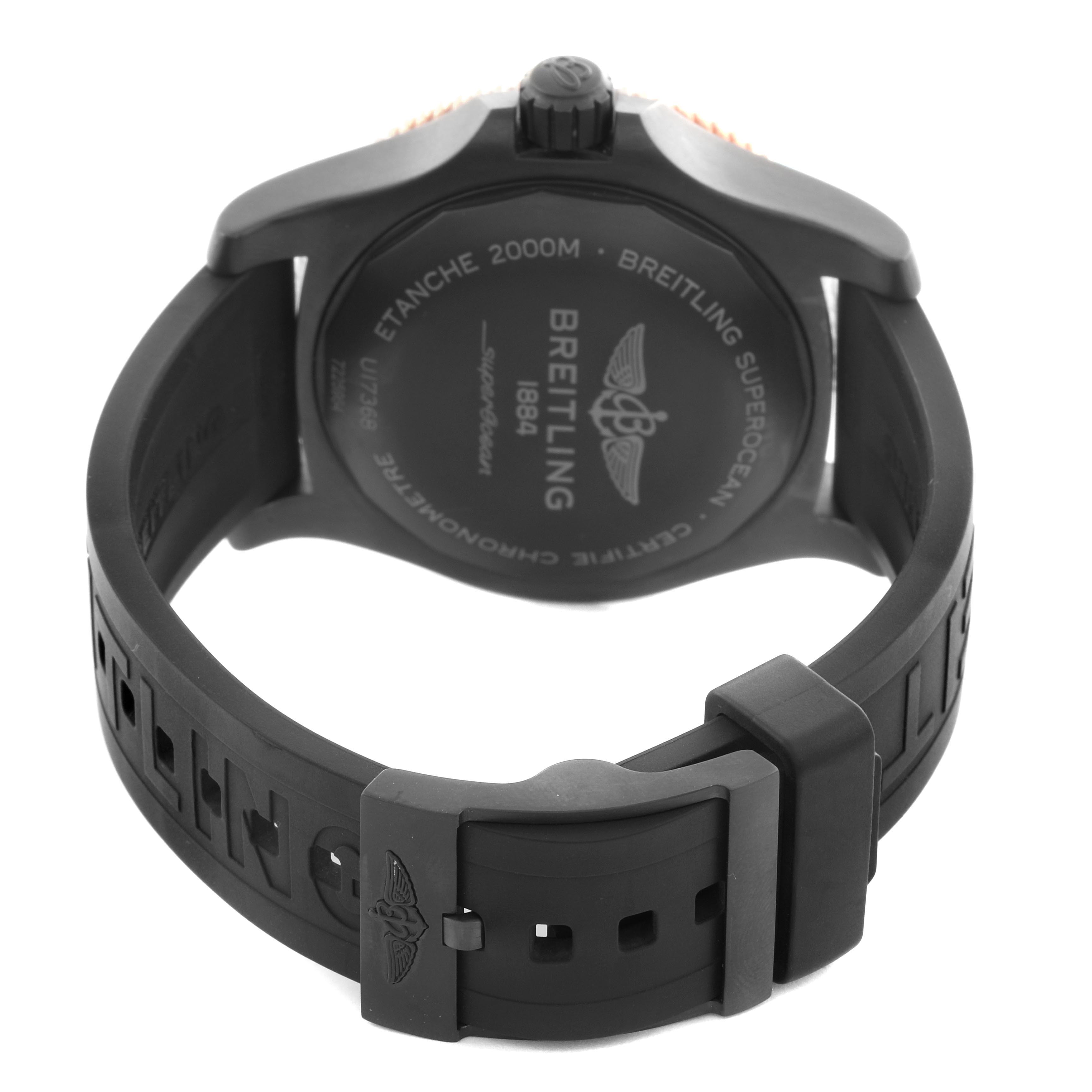 The image shows the back of a Breitling Superocean U17368 Men's Steel and Gold (two tone) Black Dial U17368 Men's Steel and Gold (two tone) Black Dial watch, including the case back and black rubber strap with a buckle.