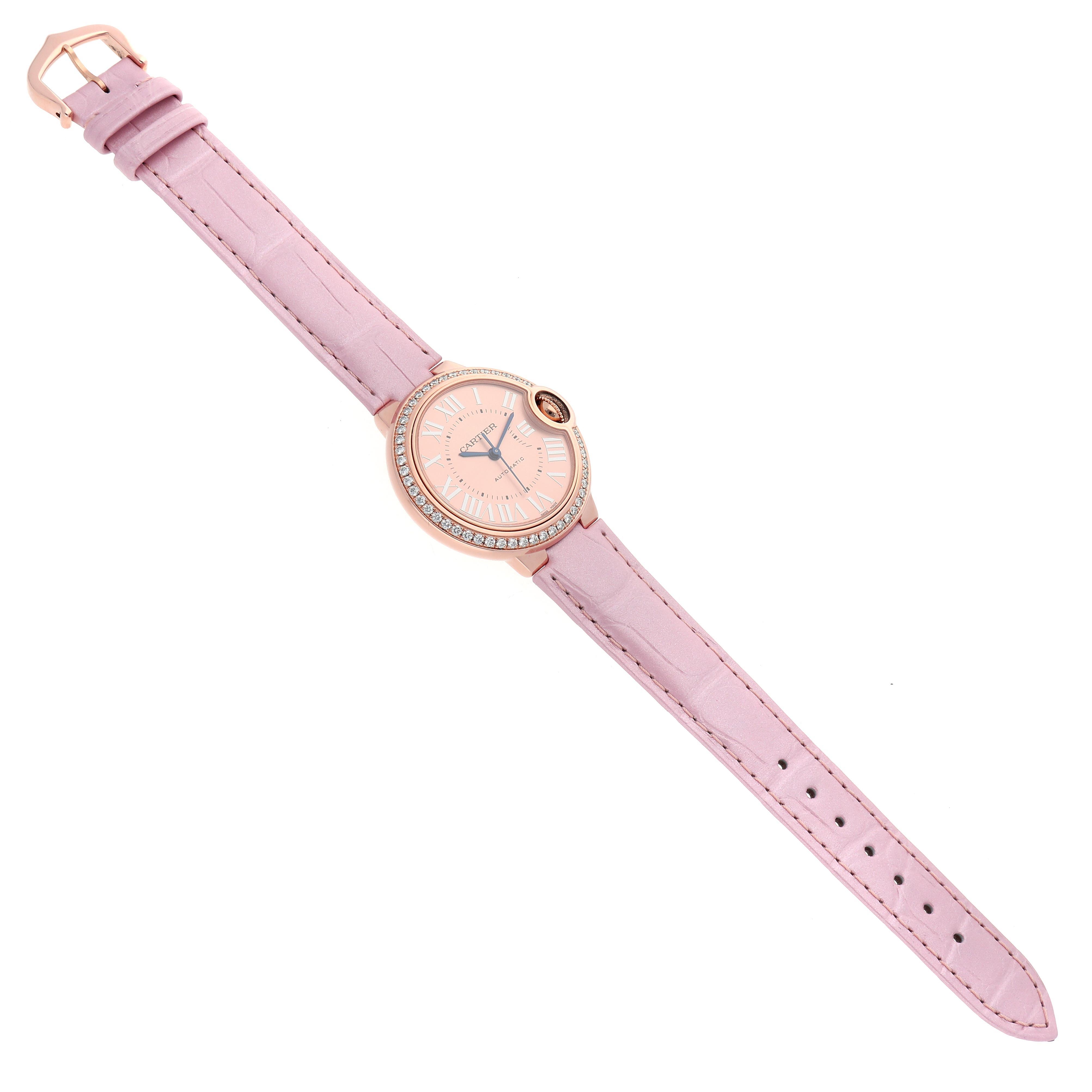 The Cartier Ballon Bleu WJBB0033 Women's Rose Gold Pink Dial WJBB0033 Women's Rose Gold Pink Dial watch is shown from a top angle, displaying the dial, strap, and buckle in full view.