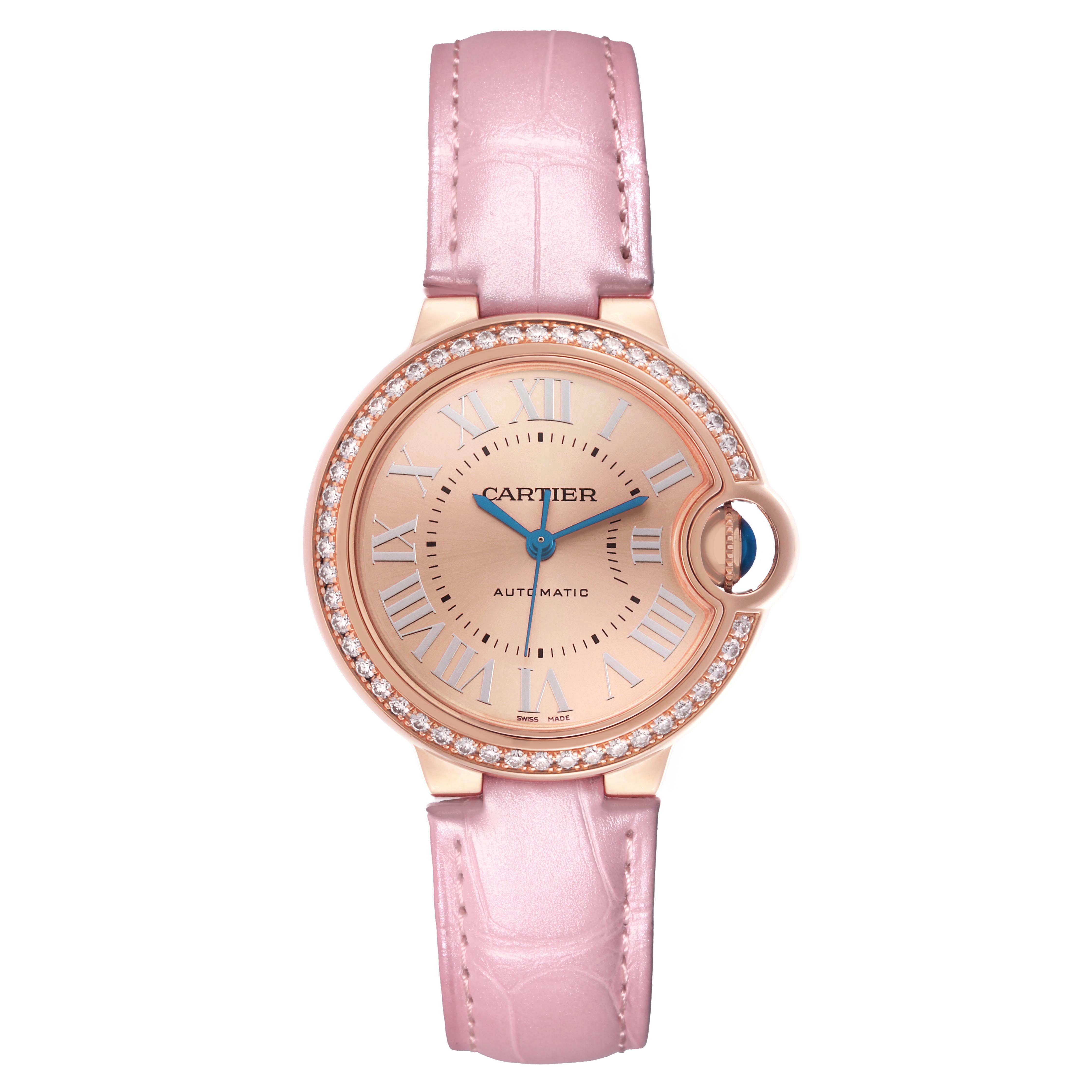 The Cartier Ballon Bleu WJBB0076 Women's Rose Gold Pink Dial watch is shown from a top-down angle, featuring the watch face, pink strap, and diamond-set bezel.