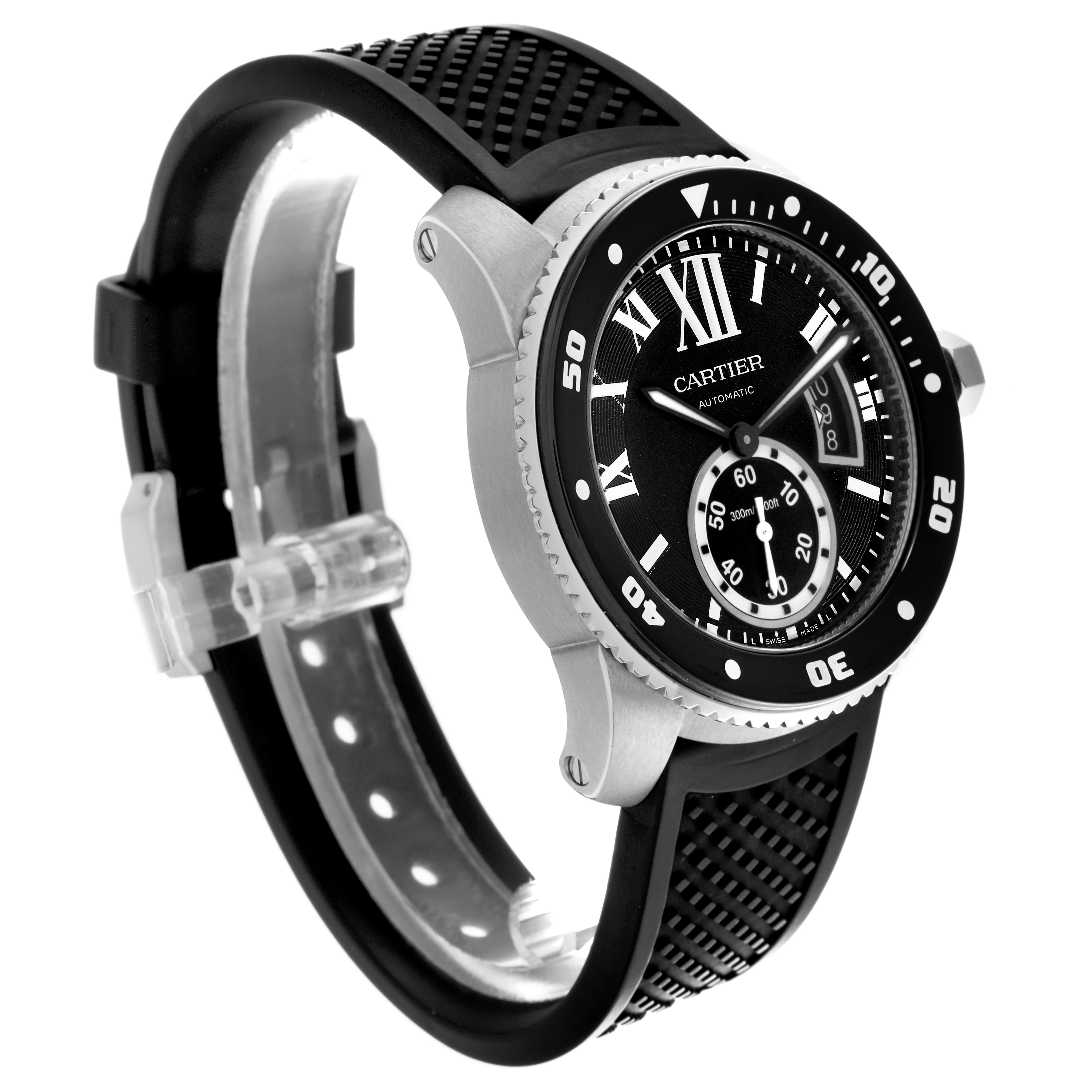 The Calibre de Cartier watch is shown at an oblique angle, highlighting the face, bezel, and part of the strap.