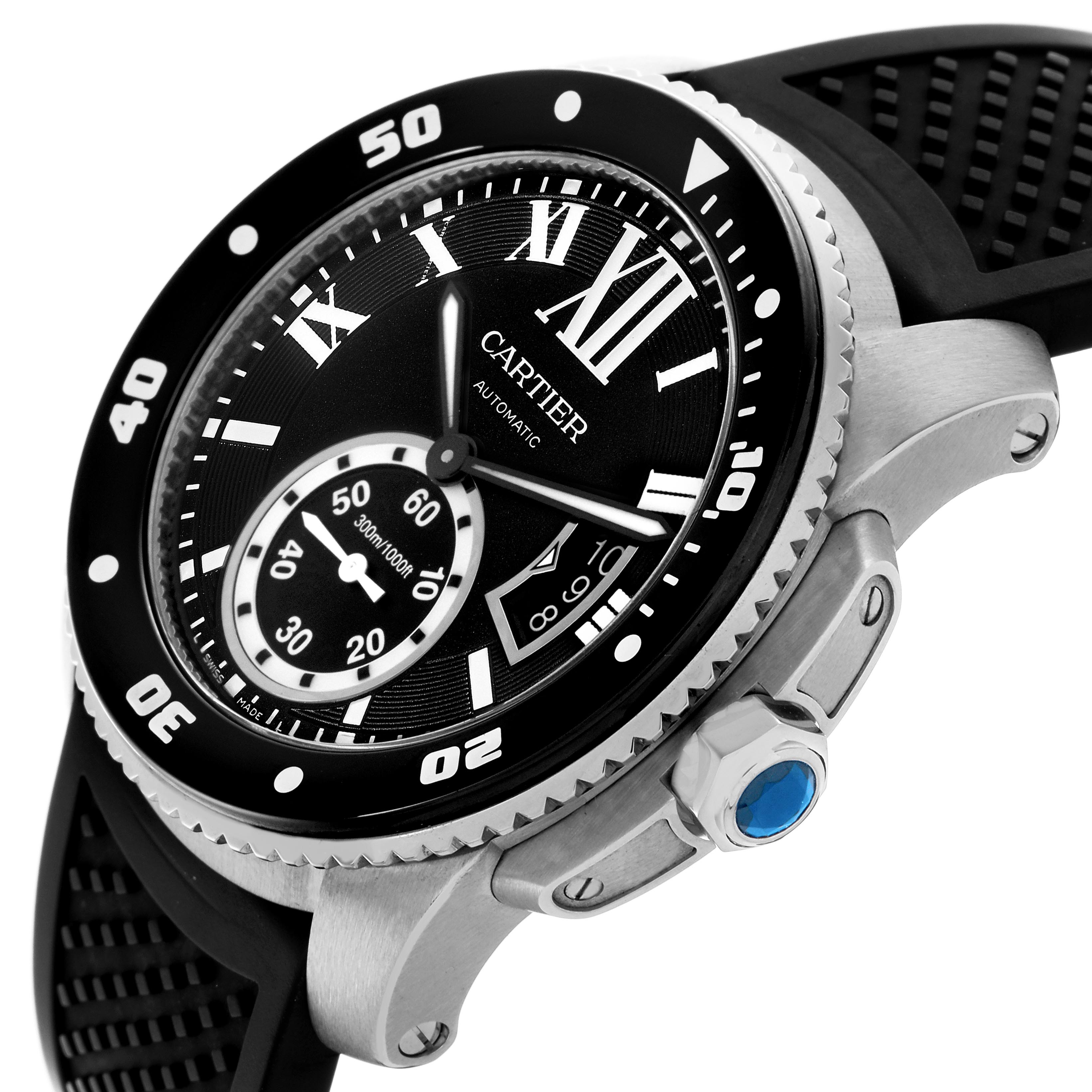 The Calibre de Cartier watch is shown at an angle displaying the bezel, dial, crown, and part of the strap.