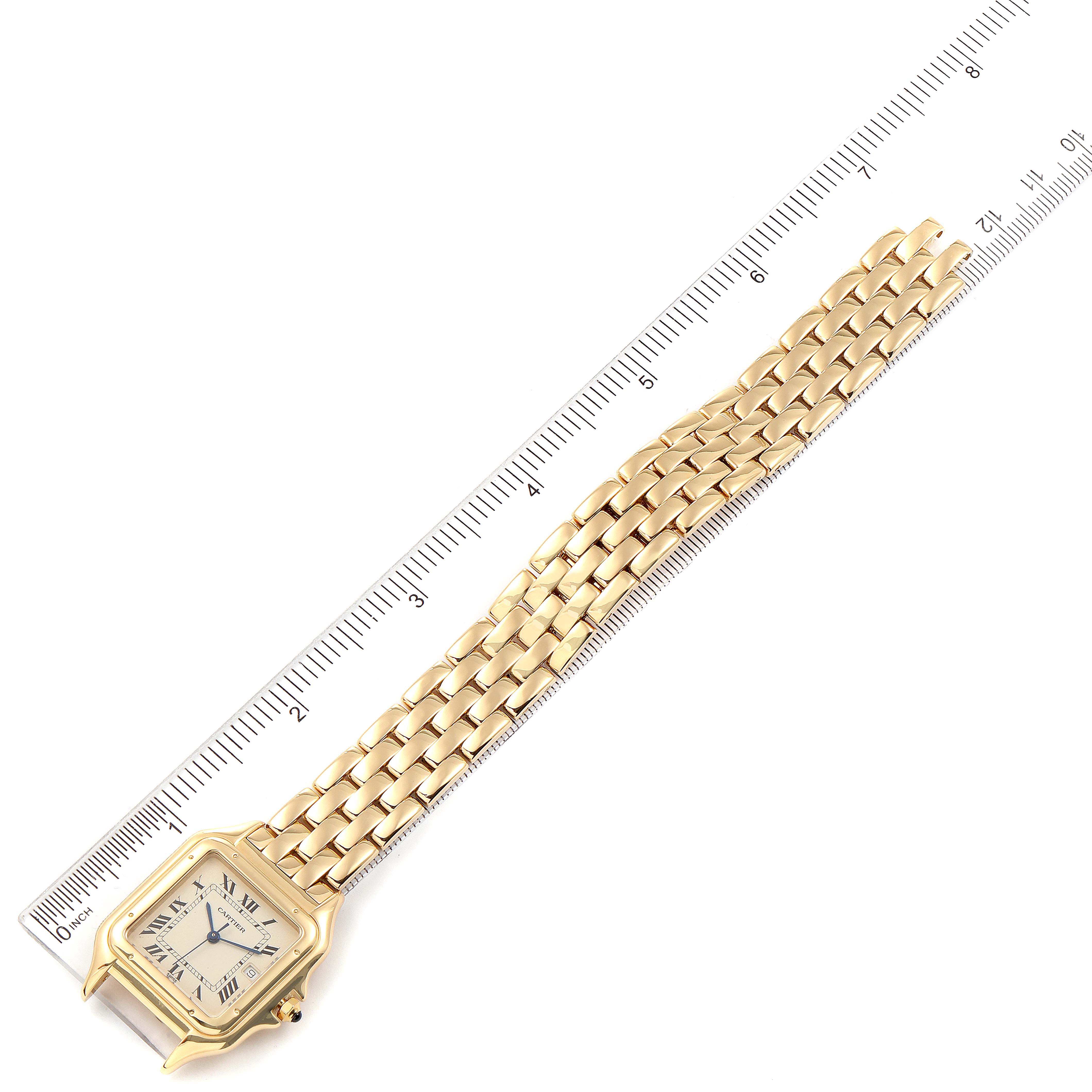 The image shows a top view of a gold Cartier Panthere W25014B9 Women's Yellow Gold Silver Dial W25014B9 Women's Yellow Gold Silver Dial watch, placed next to a ruler for size reference.
