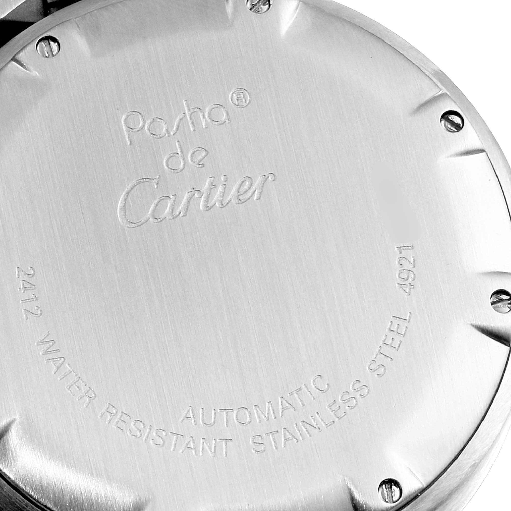 The image shows the case back of a Cartier Pasha W31048M7 Men's Stainless Steel Silver Dial W31048M7 Men's Stainless Steel Silver Dial watch, highlighting engravings and screws.