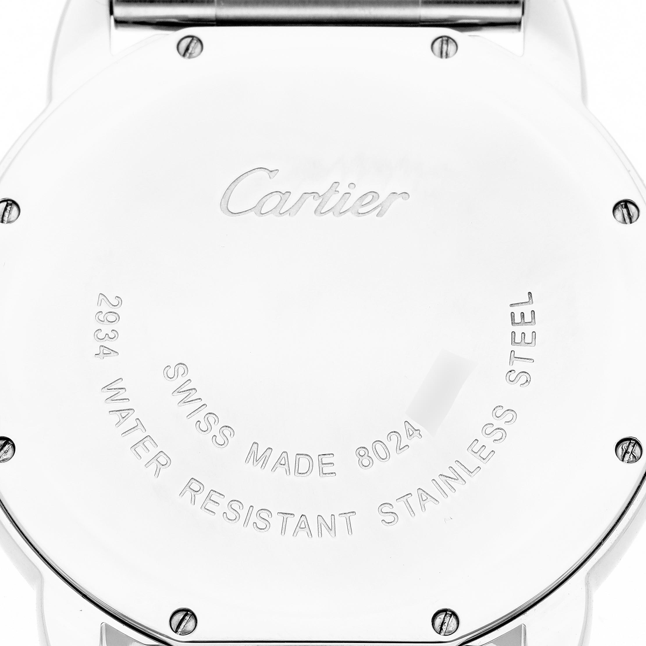 The image shows the back of the Cartier Ronde W6701005 Men
s Stainless Steel Silver Dial W6701005 Men
s Stainless Steel Silver Dial watch, featuring engravings and the case
s screws.