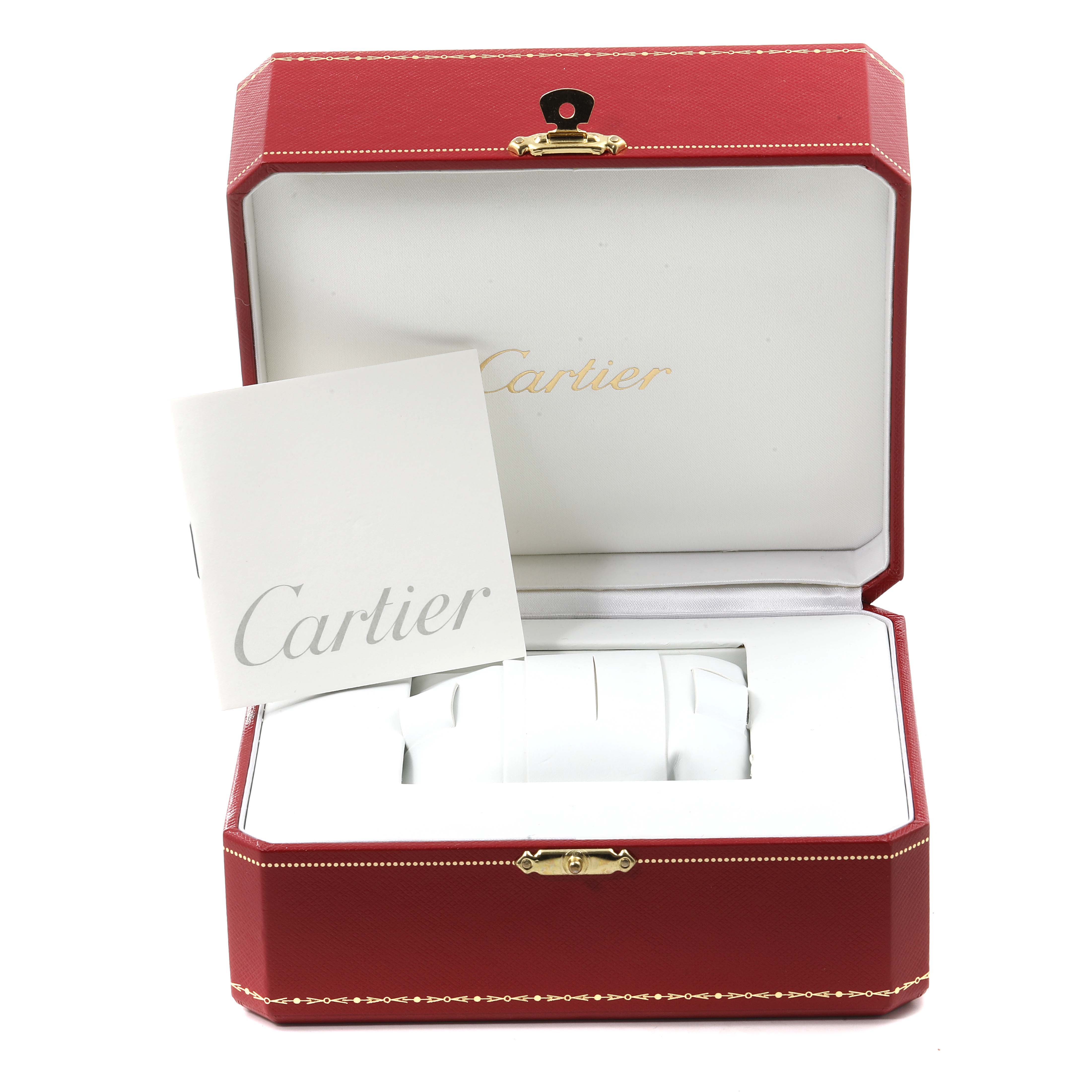 The image shows a Cartier Santos W20129U2 Men
s Stainless Steel Silver Dial W20129U2 Men
s Stainless Steel Silver Dial watch box and booklet, photographed from the front and slightly above.
