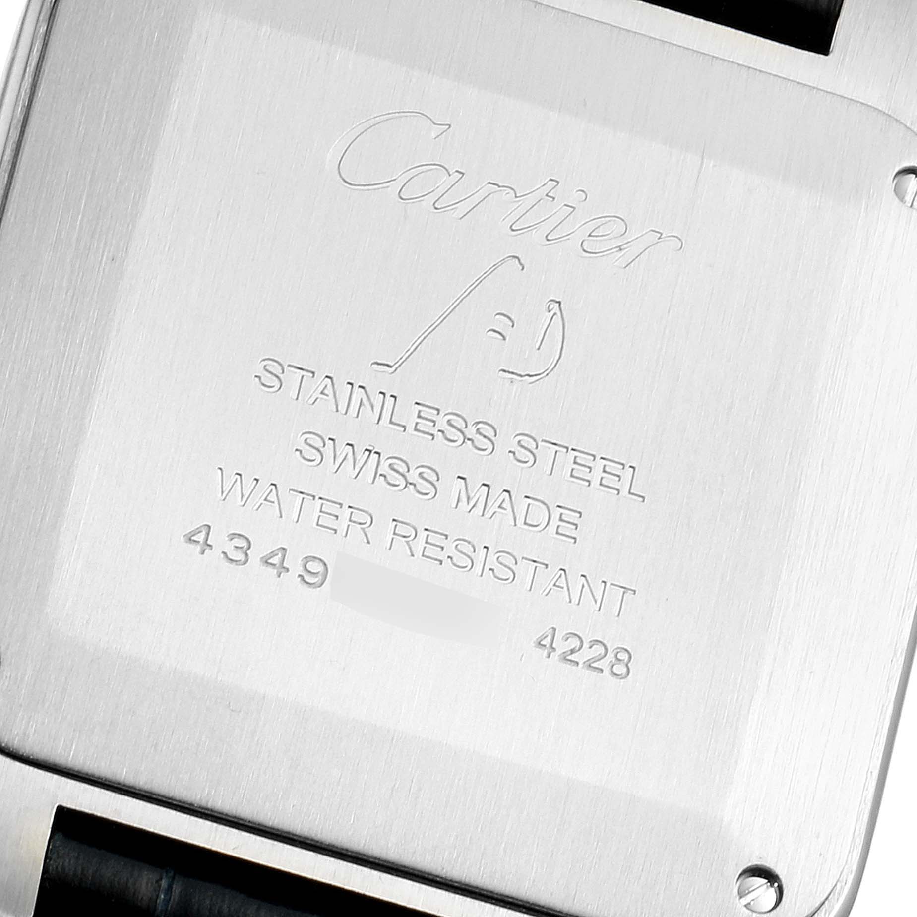 This image shows the back case of a Cartier Santos Dumont WSSA0022 Men's Stainless Steel Silver Dial WSSA0022 Men's Stainless Steel Silver Dial watch, featuring its engraved specifications.