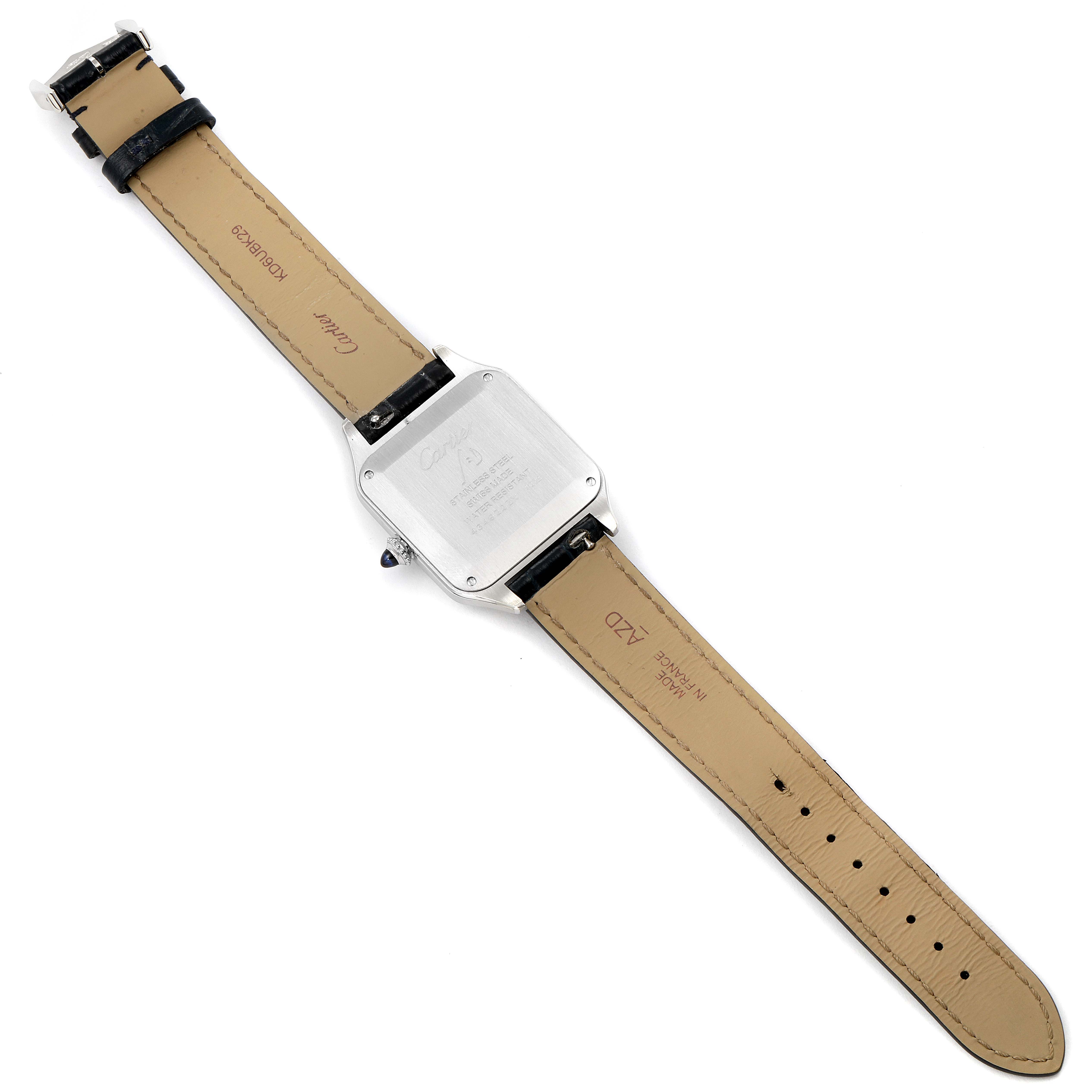 This image shows the backside and strap of a Santos Dumont model by Cartier, laid flat.