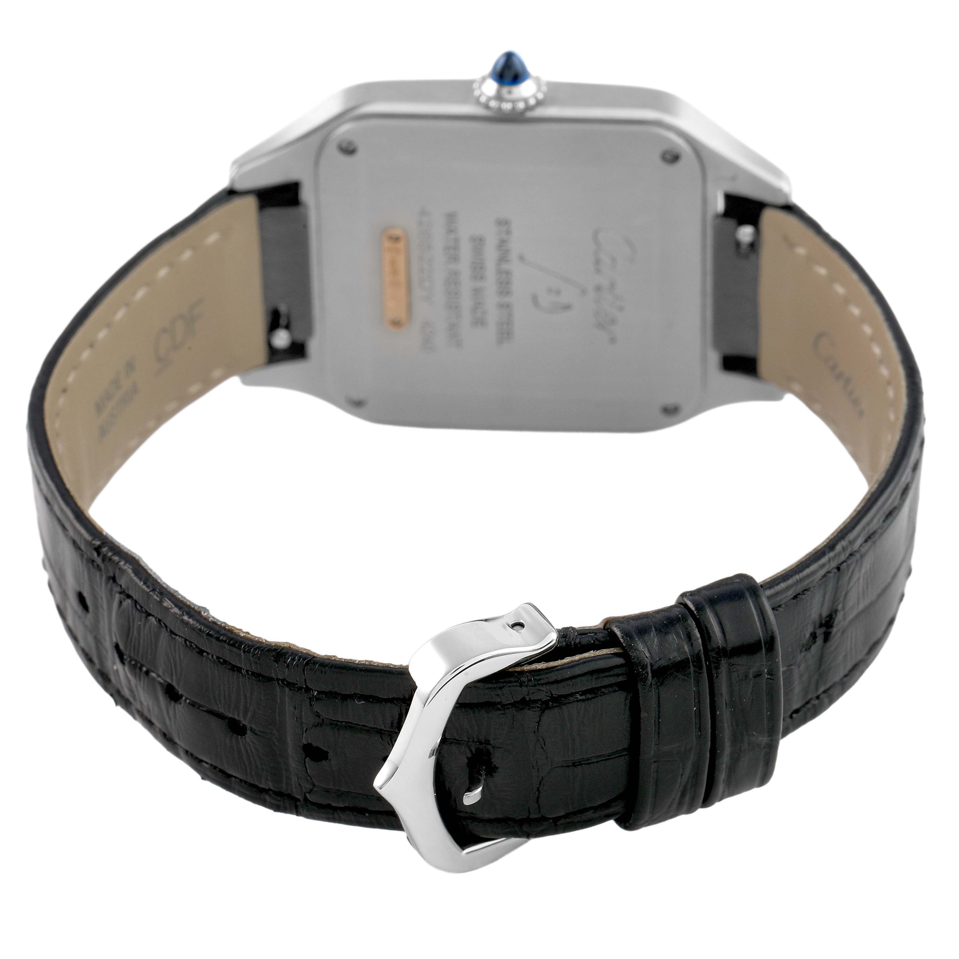 The Cartier Santos Dumont W2SA0011 Men's Stainless Steel Silver Dial watch is shown from the back, highlighting the case back, black leather strap, and buckle.