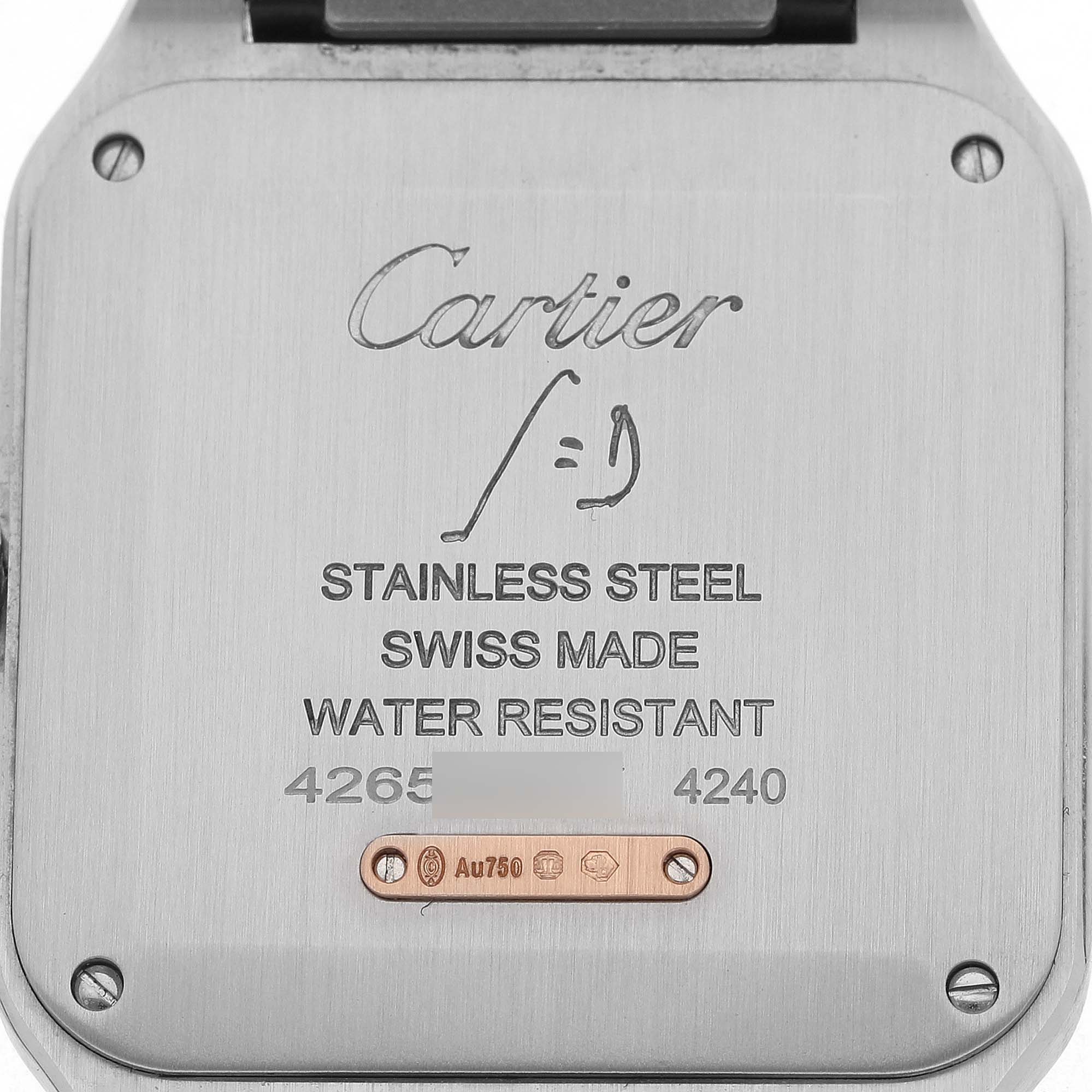 The image shows the back case of the Cartier Santos Dumont W2SA0011 Men's Stainless Steel Silver Dial watch, highlighting its stainless steel construction and inscriptions.