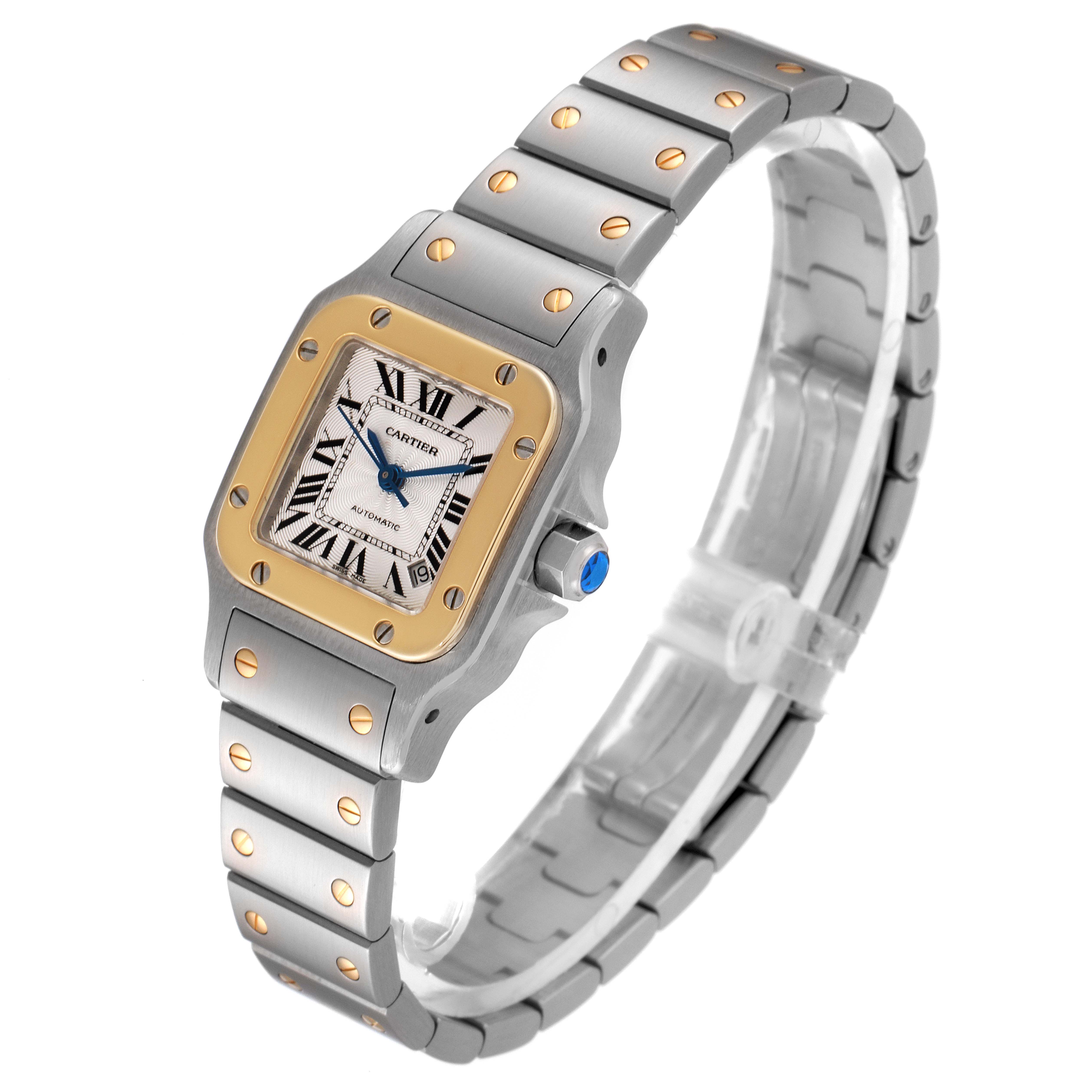 The Cartier Santos W20057C4 Women's Steel and Gold (two tone) Silver Dial W20057C4 Women's Steel and Gold (two tone) Silver Dial watch is shown from a slight top angle, displaying the face, bezel, and bracelet.