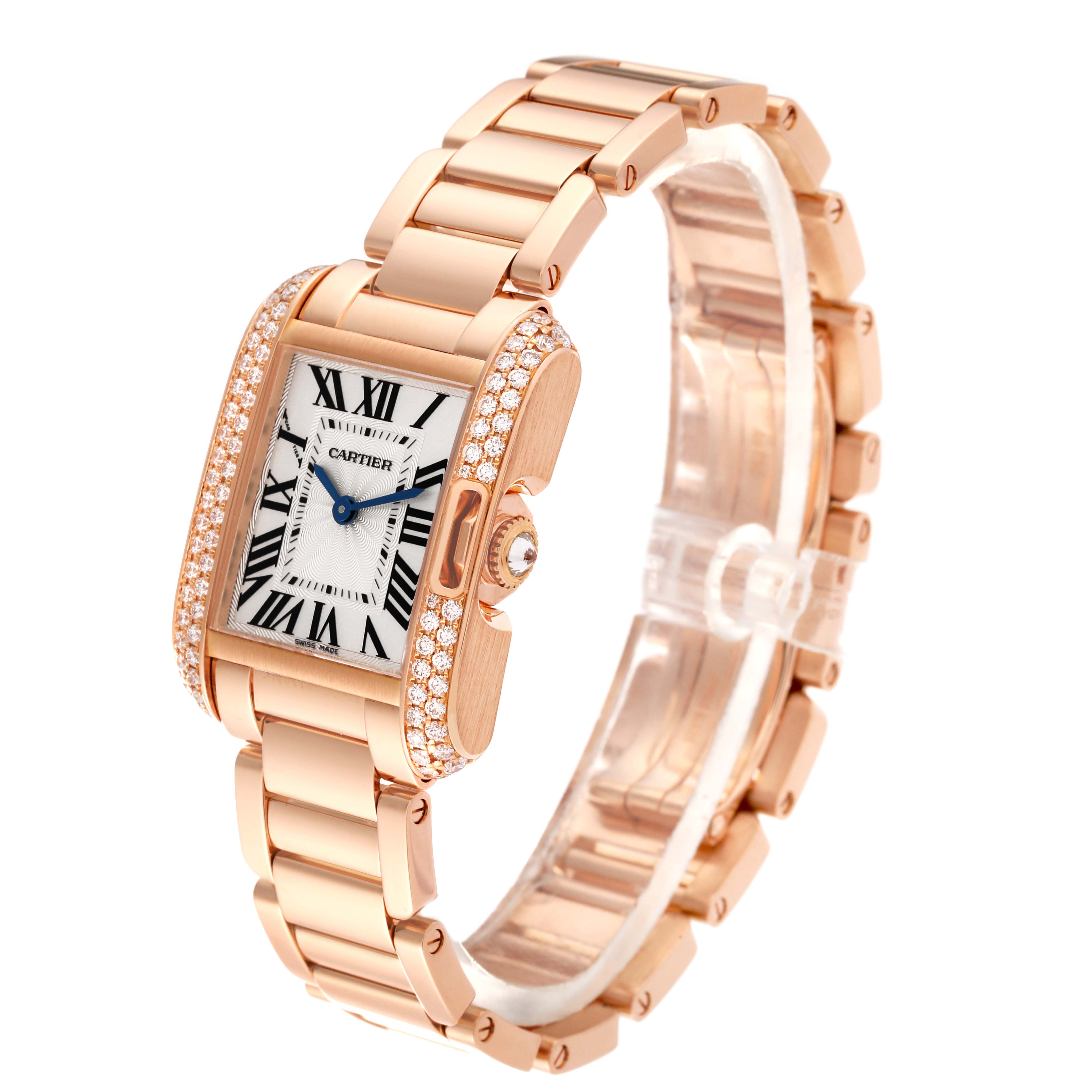 The Cartier Tank Anglaise WT100002 Women
s Rose Gold Silver Dial WT100002 Women
s Rose Gold Silver Dial watch is shown from a three-quarter angle, highlighting its face, bracelet, and diamond-set case.