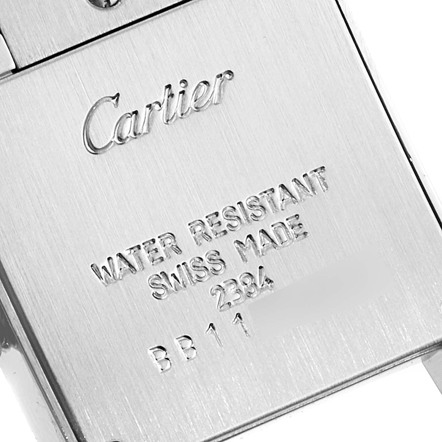 This close-up image shows the back case of a Cartier Tank Francaise W51008Q3 Women's Stainless Steel Silver Dial W51008Q3 Women's Stainless Steel Silver Dial watch, featuring engraved branding and specifications.