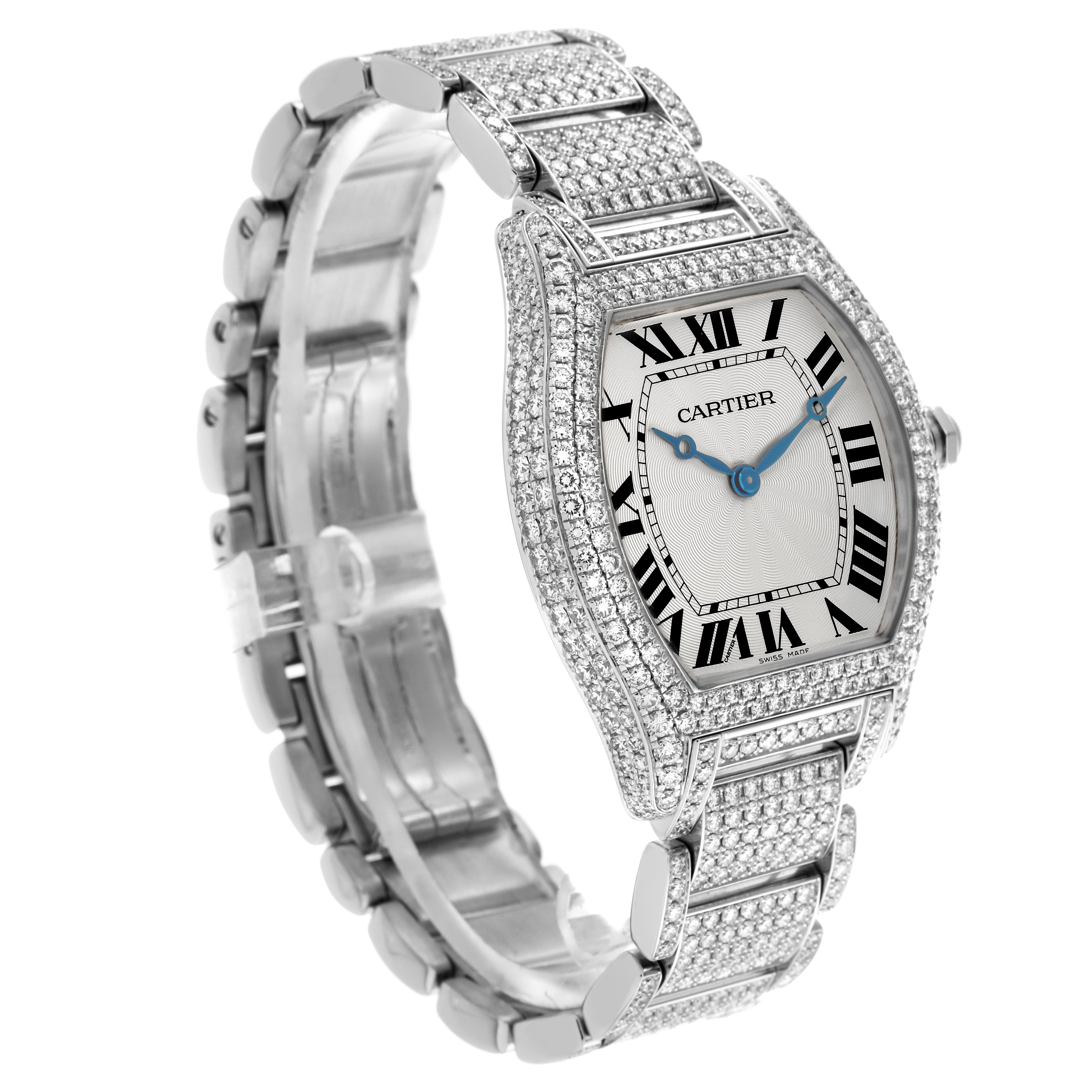 The Cartier Tortue WA5043MC Men's White Gold Silver Dial WA5043MC Men's White Gold Silver Dial watch is angled to show the bracelet and face embellished with diamonds.