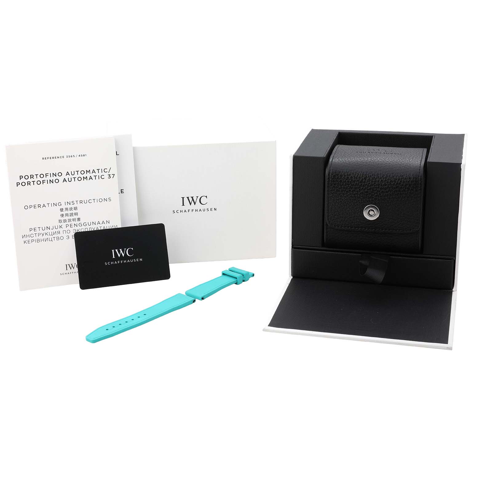 The IWC Pilot IW370607 Men's Titanium Black Dial model watch accessories include a leather case, turquoise strap, manuals, and a card, all displayed from a frontal angle.