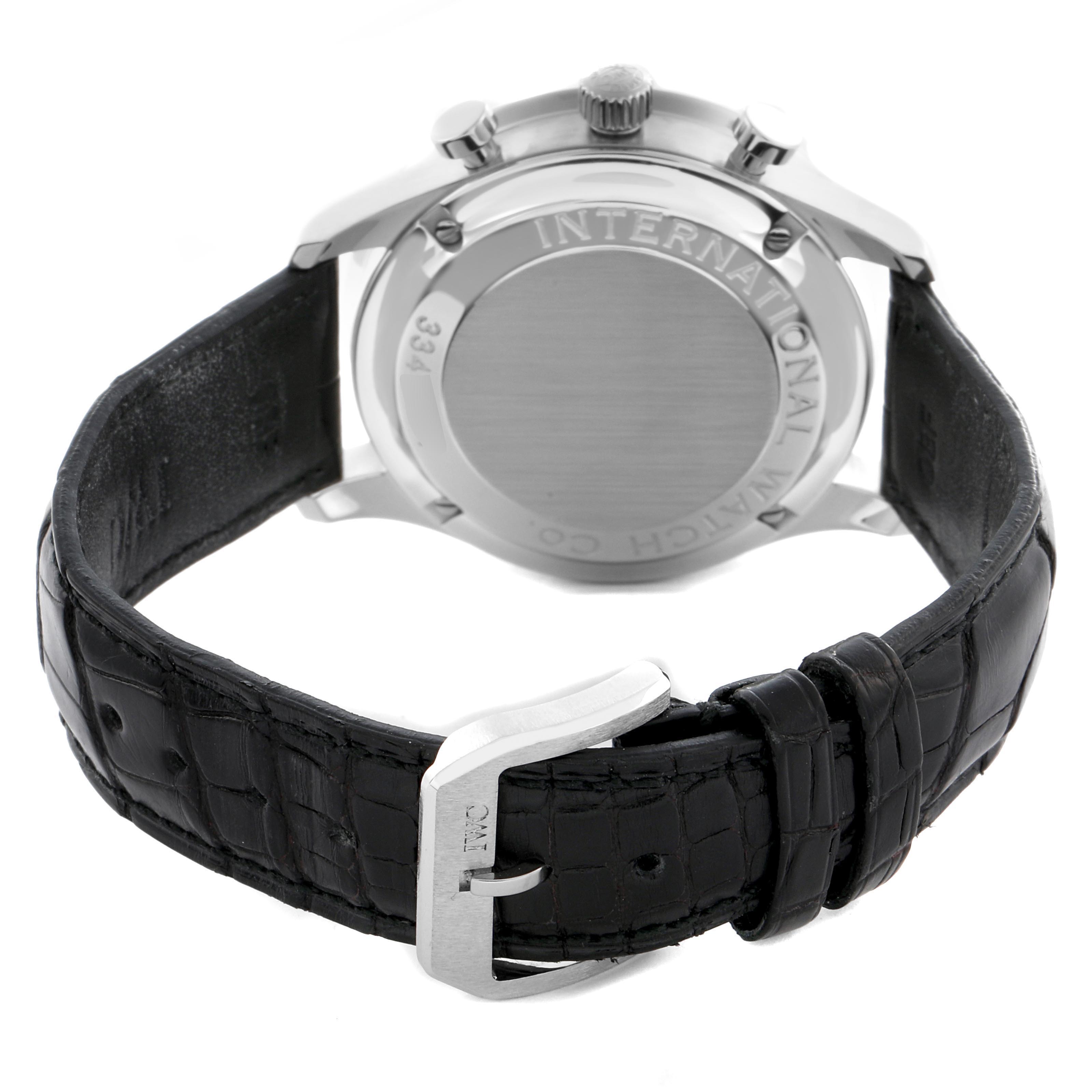 The image shows the back of the IWC Portuguese IW371401 Men's Stainless Steel Silver Dial IW371401 Men's Stainless Steel Silver Dial watch, highlighting the case back, crown, and black leather strap with a clasp.