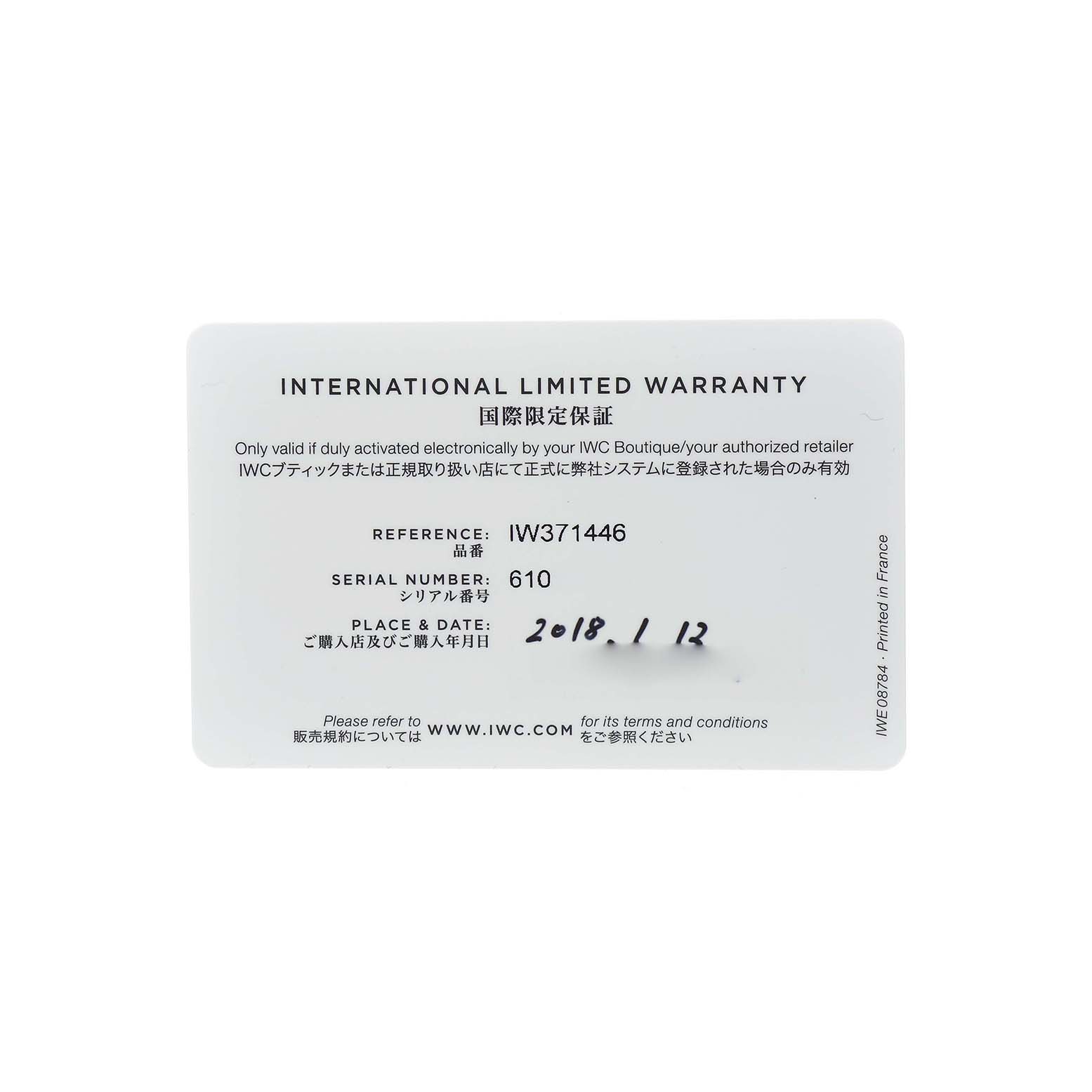 This image shows the warranty card for the IWC Portuguese IW371446 Men's Stainless Steel Silver Dial model, displaying reference and serial numbers.