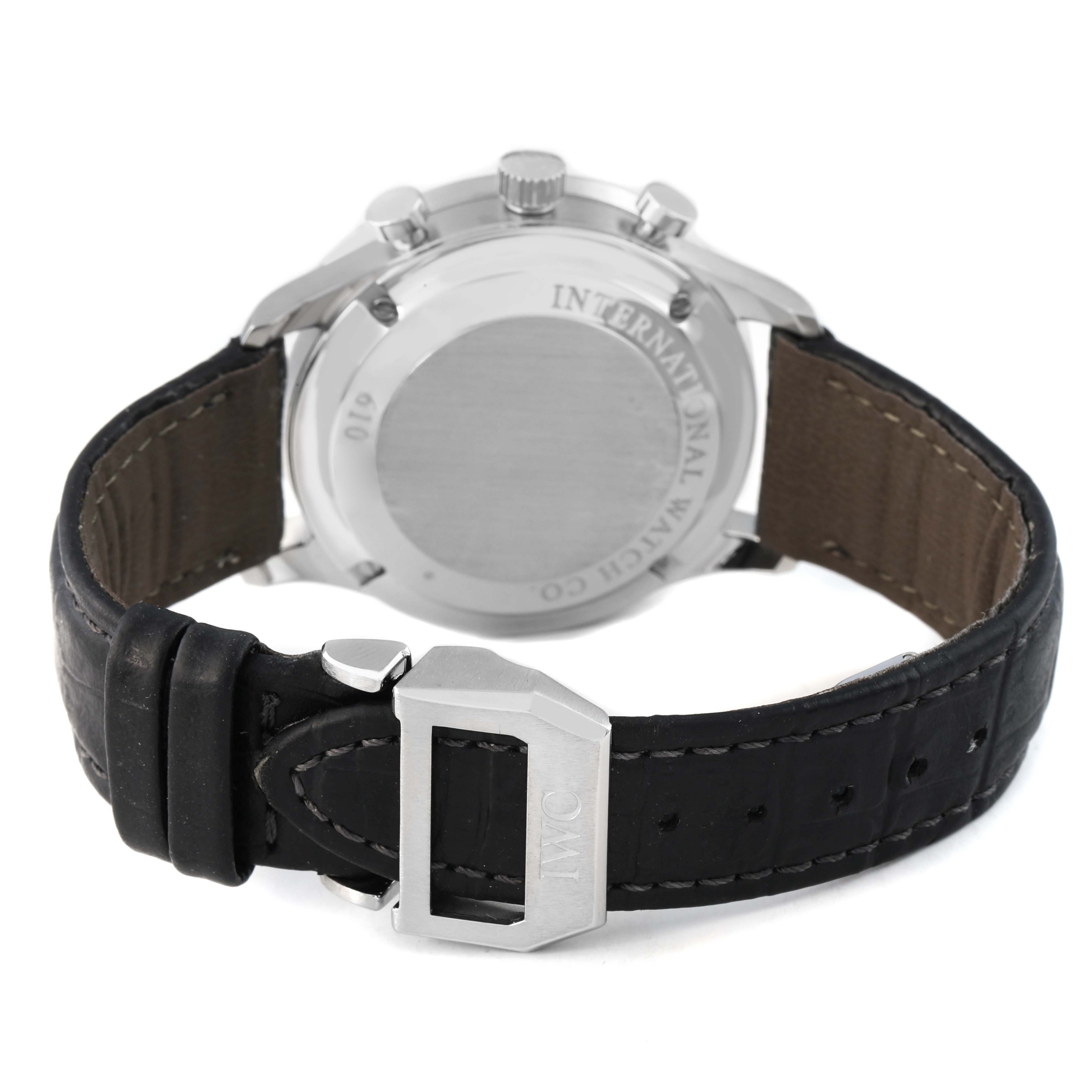 The IWC Portuguese IW371446 Men's Stainless Steel Silver Dial watch is shown from the back, highlighting the case back, pushers, and leather strap with the IWC buckle.